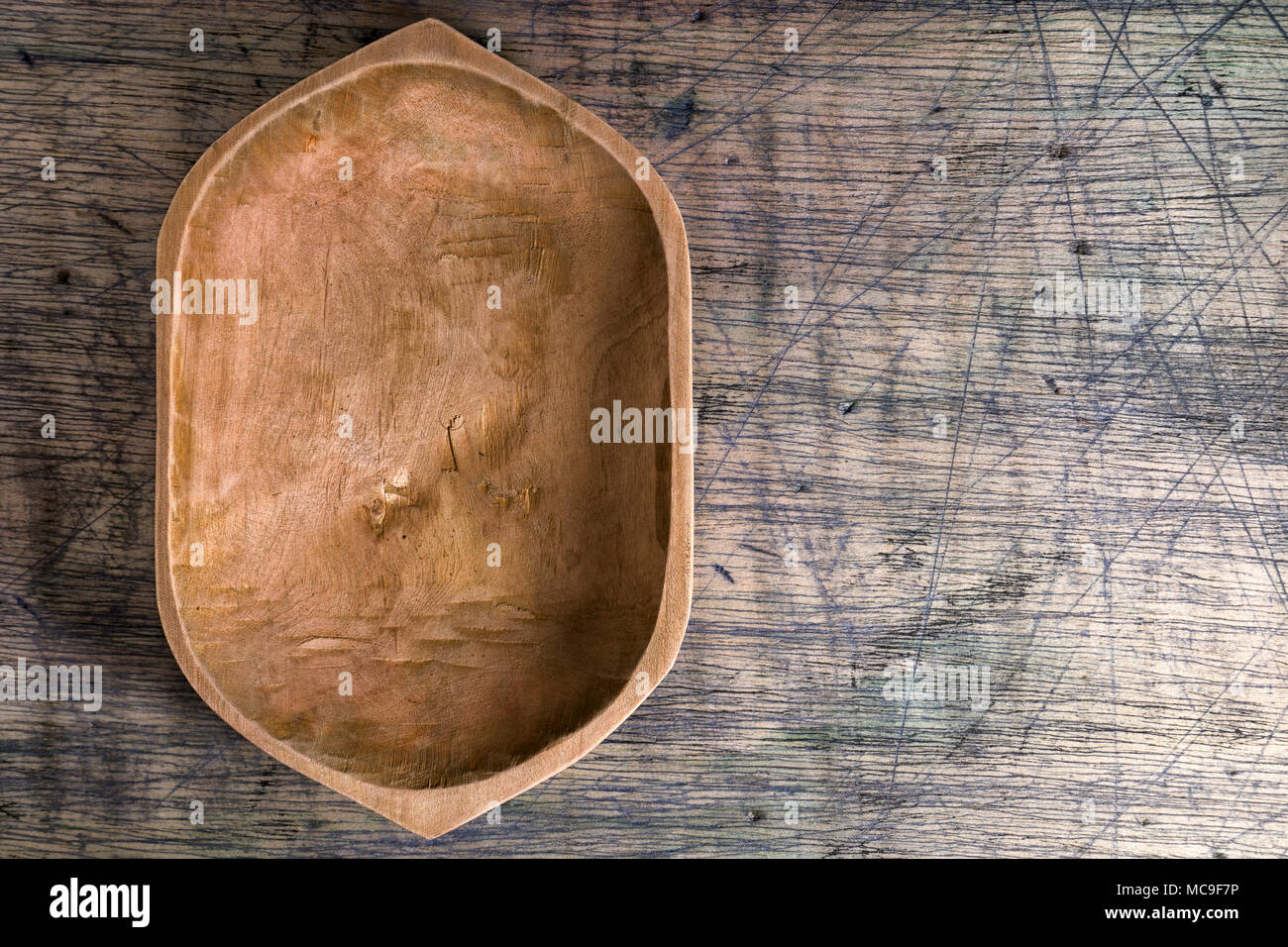 rustic wood bowl on wood surface Stock Photo