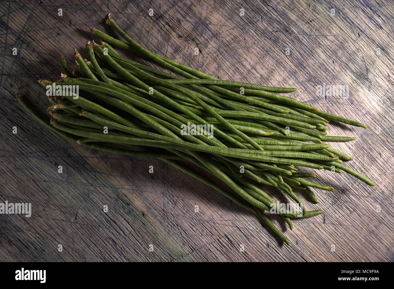 chinese yard-long long beans bundle on wood surface Stock Photo