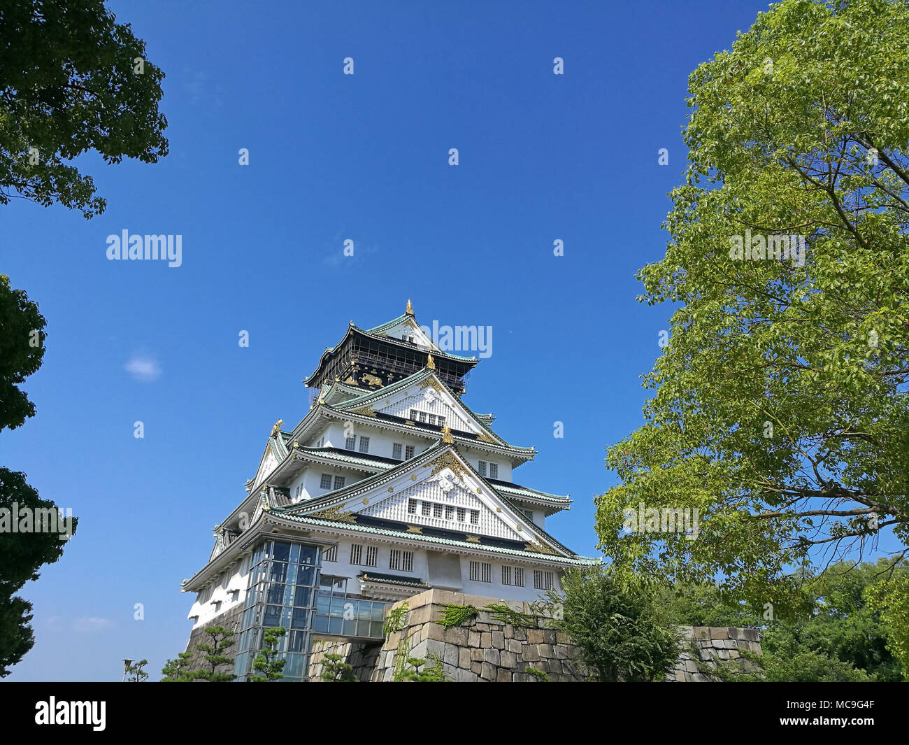Sacred charming osaka castle with blue sky stock image