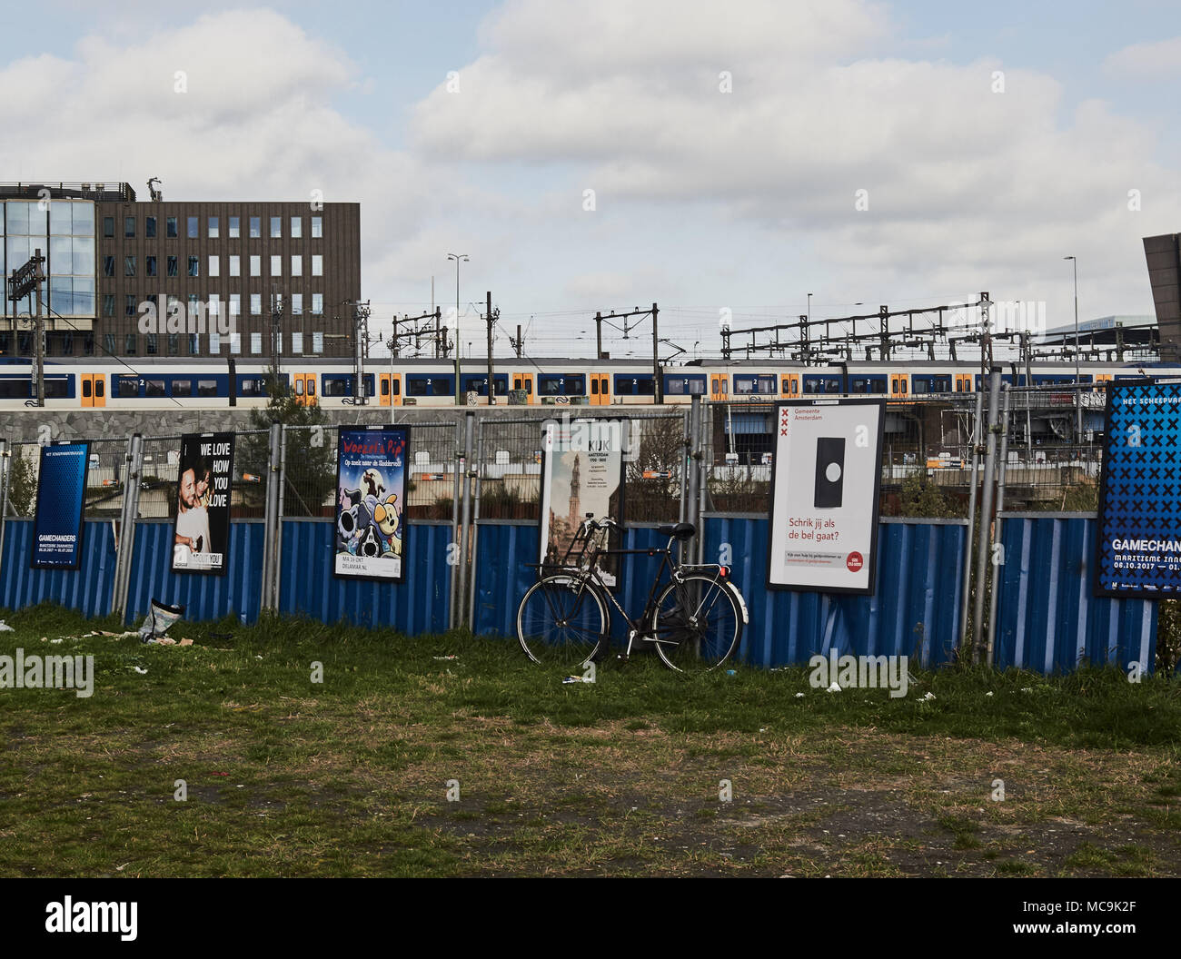 Advertising boards and bicycle in urban landscape, Amsterdam, Netherlands Stock Photo