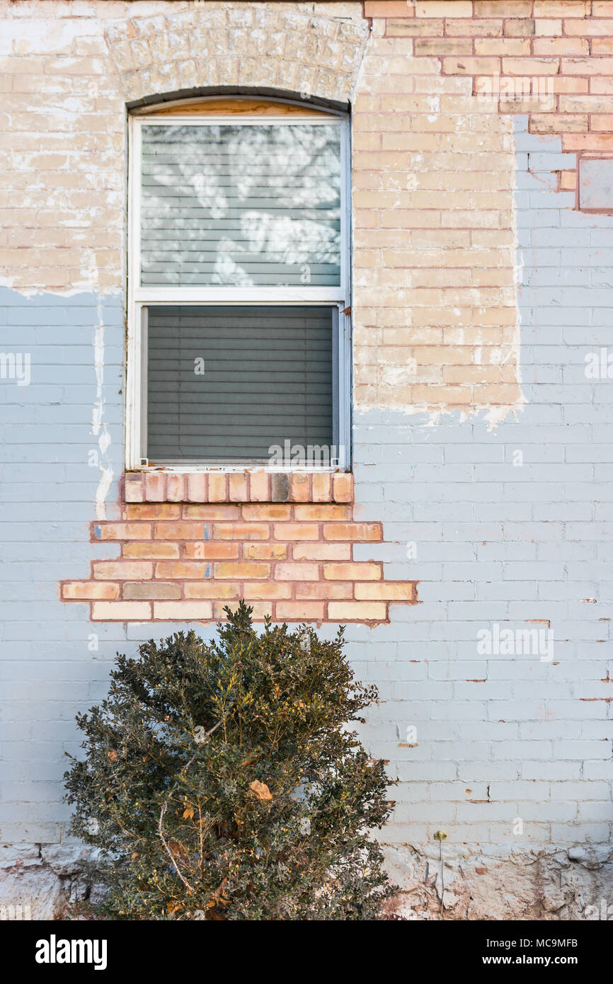 Window in distressed light blue painted brick wall Stock Photo Alamy