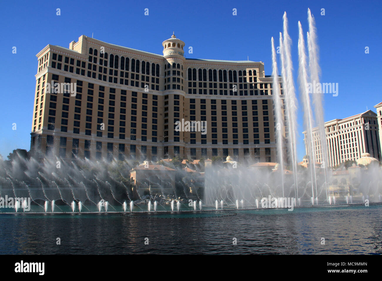 The dancing water fountains of the Bellagio Hotel and Casino Resort during a show at daylight in Las Vegas, NV, USA Stock Photo