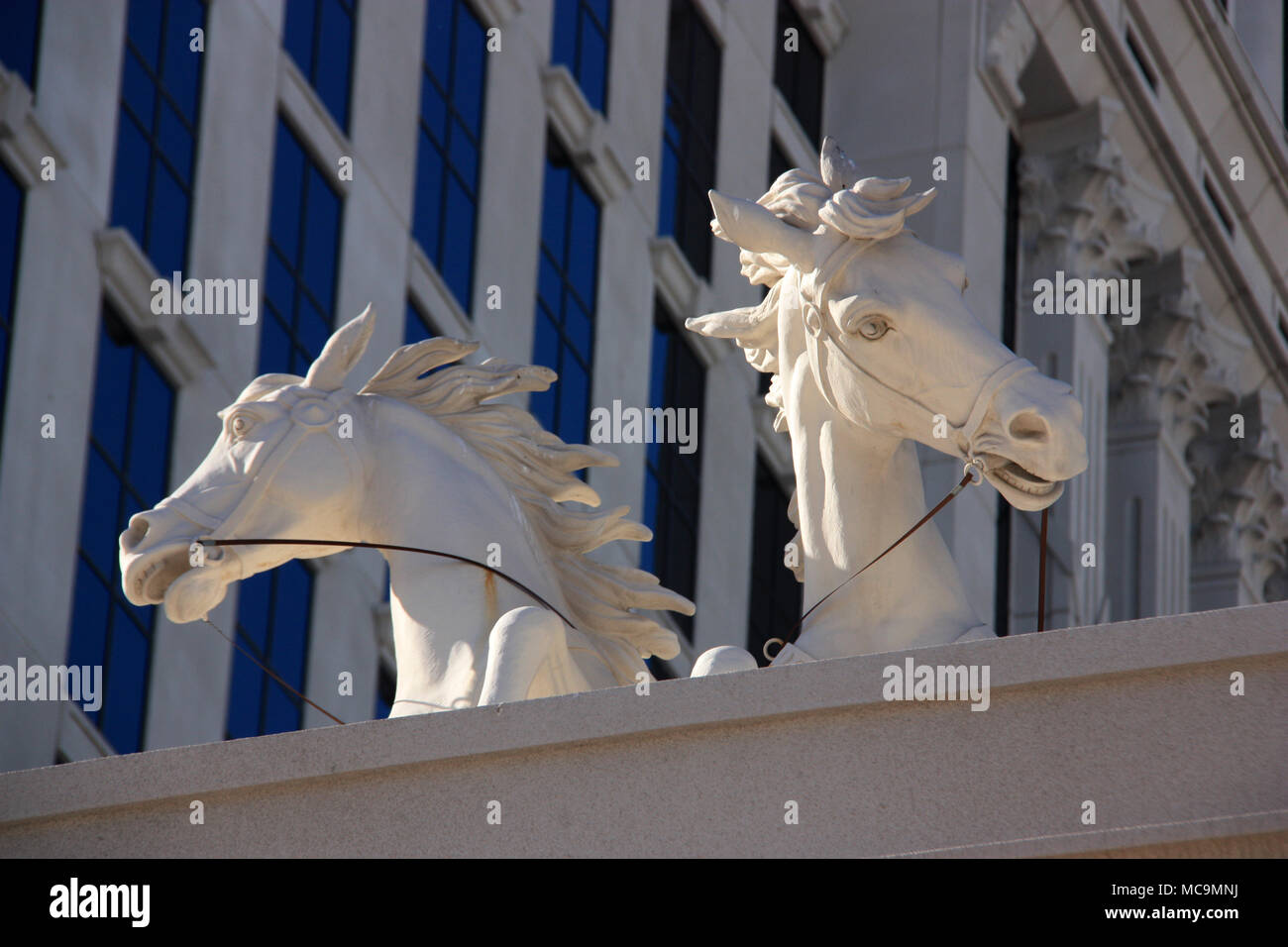 Replica of a marble statue of two wild horses with bridle on top of a building of the Caesars Palace Hotel and Casino in Las Vegas, NV, USA Stock Photo