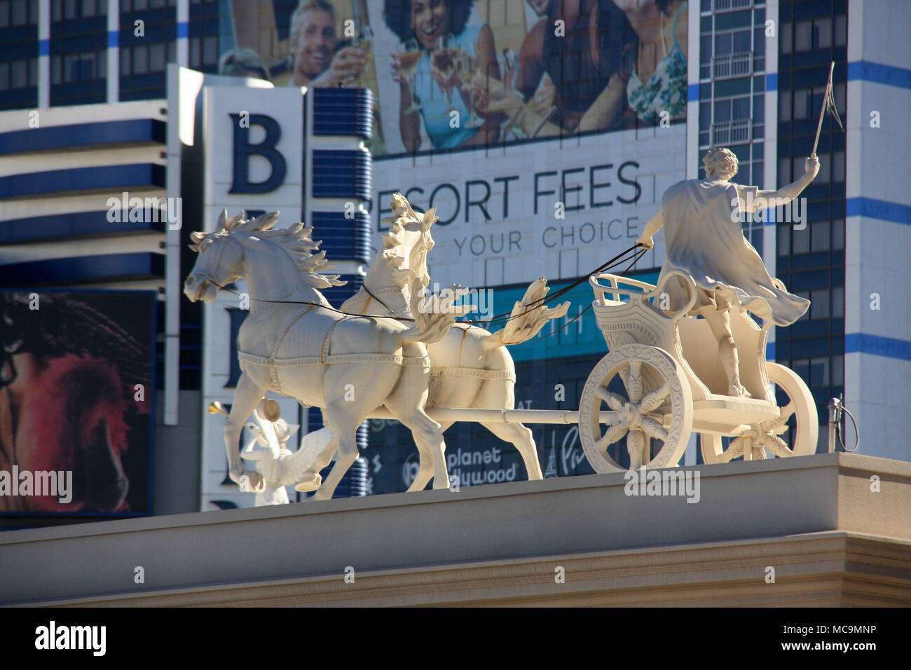 Replica of a marble statue of two wild horses towing a chariot on top of a building of the Caesars Palace Hotel and Casino in Las Vegas, NV, USA Stock Photo