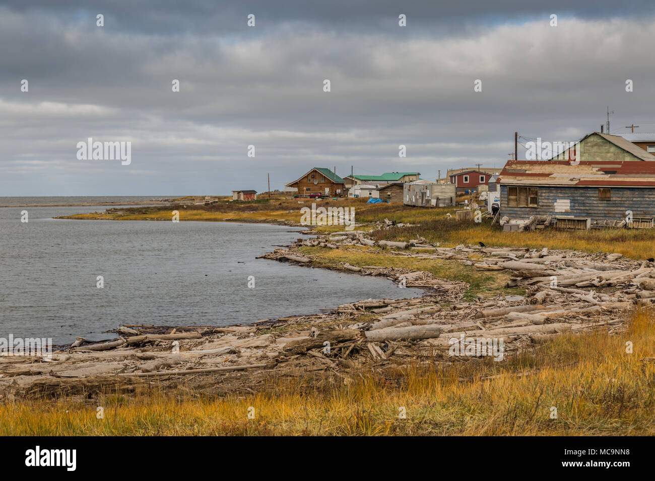 The hamlet of Tuktoyaktuk along the eroding shoreline of the Arctic Ocean, Northwest Territories,Canada, where sea ice is melting at an alarming rate. Stock Photo