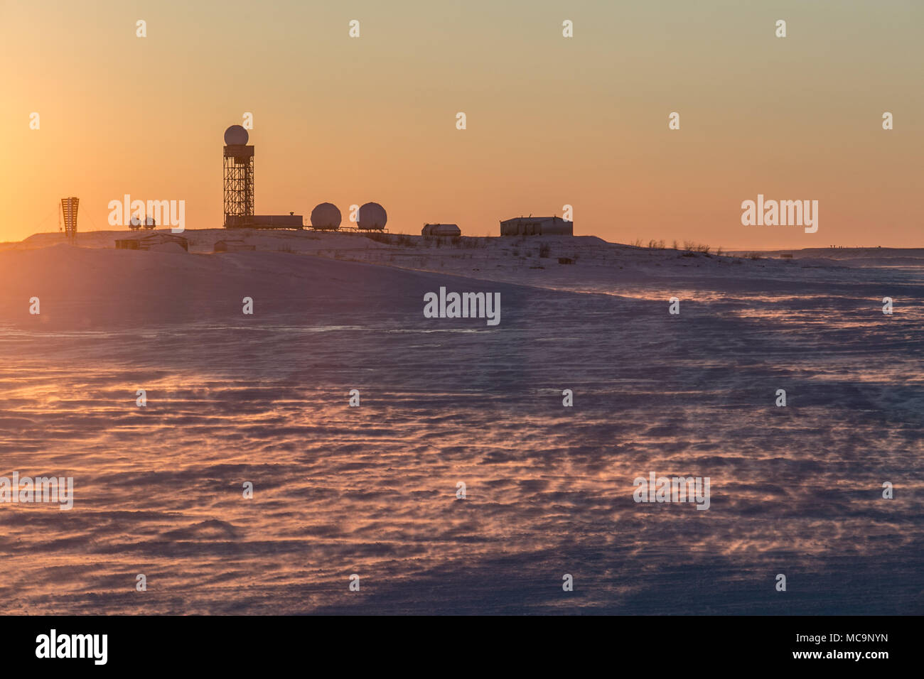 Abandoned buildings of the Distant Early Warning (DEW) Line in the arctic hamlet of Tuktoyaktuk, Northwest Territories, Canada. Stock Photo