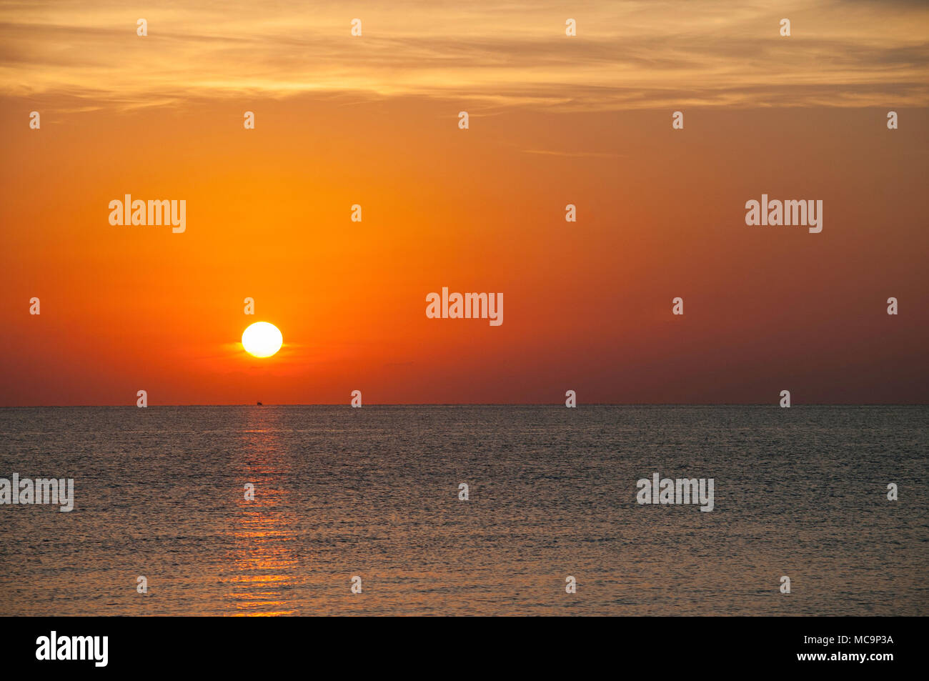 Early morning golden sunrise on a southern Florida beach. Stock Photo