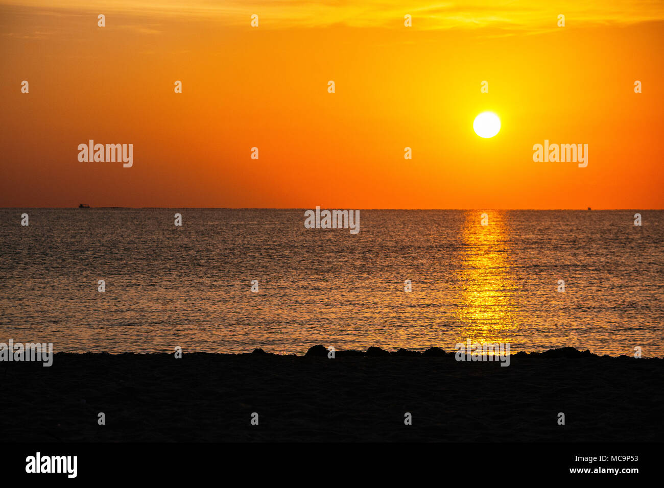 Sunrise, sunset on Hollywood beach, Florida with silhouettes. Stock Photo