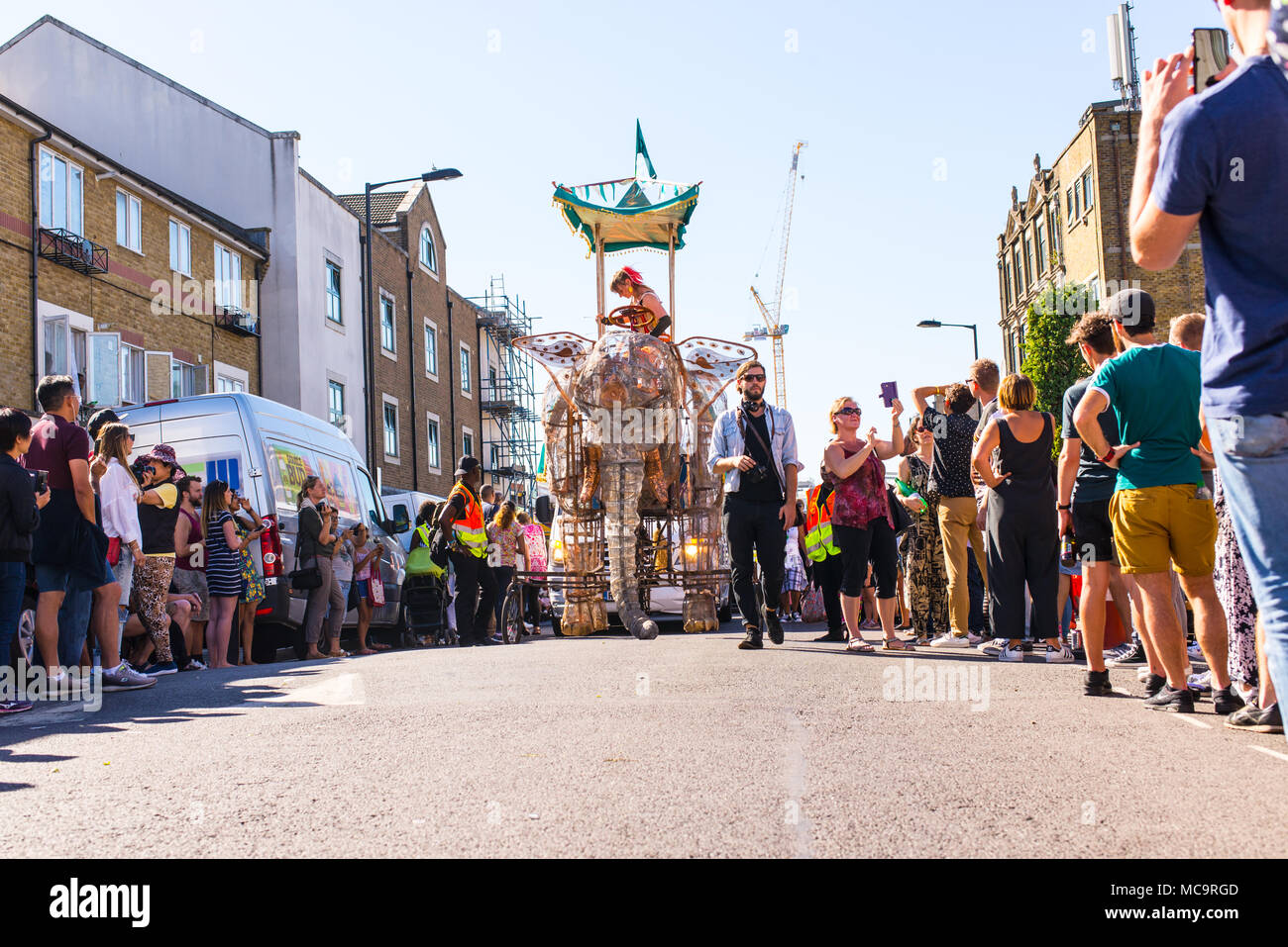 Hackney, London, UK. 11th September 2016. People watching the parade with a big elephant float approaching during the Hackney Carnival 2016 in Ridley  Stock Photo