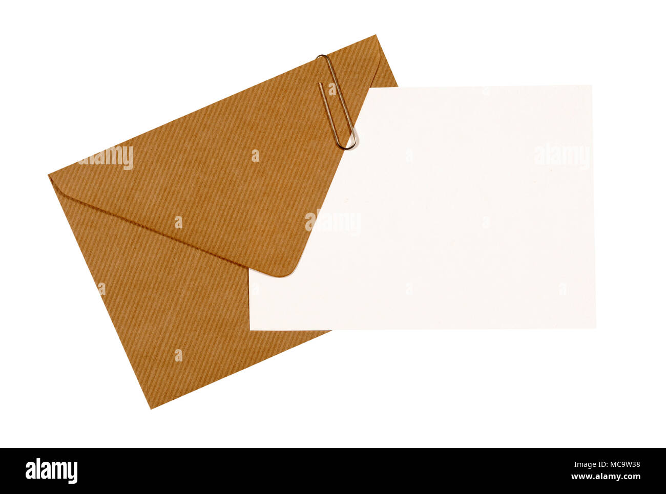 Brown manila envelope, blank letter or message card, paper clip, copy