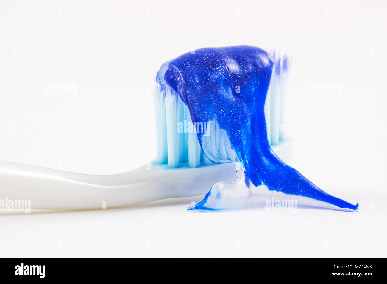 Toothbrush and toothpaste on white background. Stock Photo