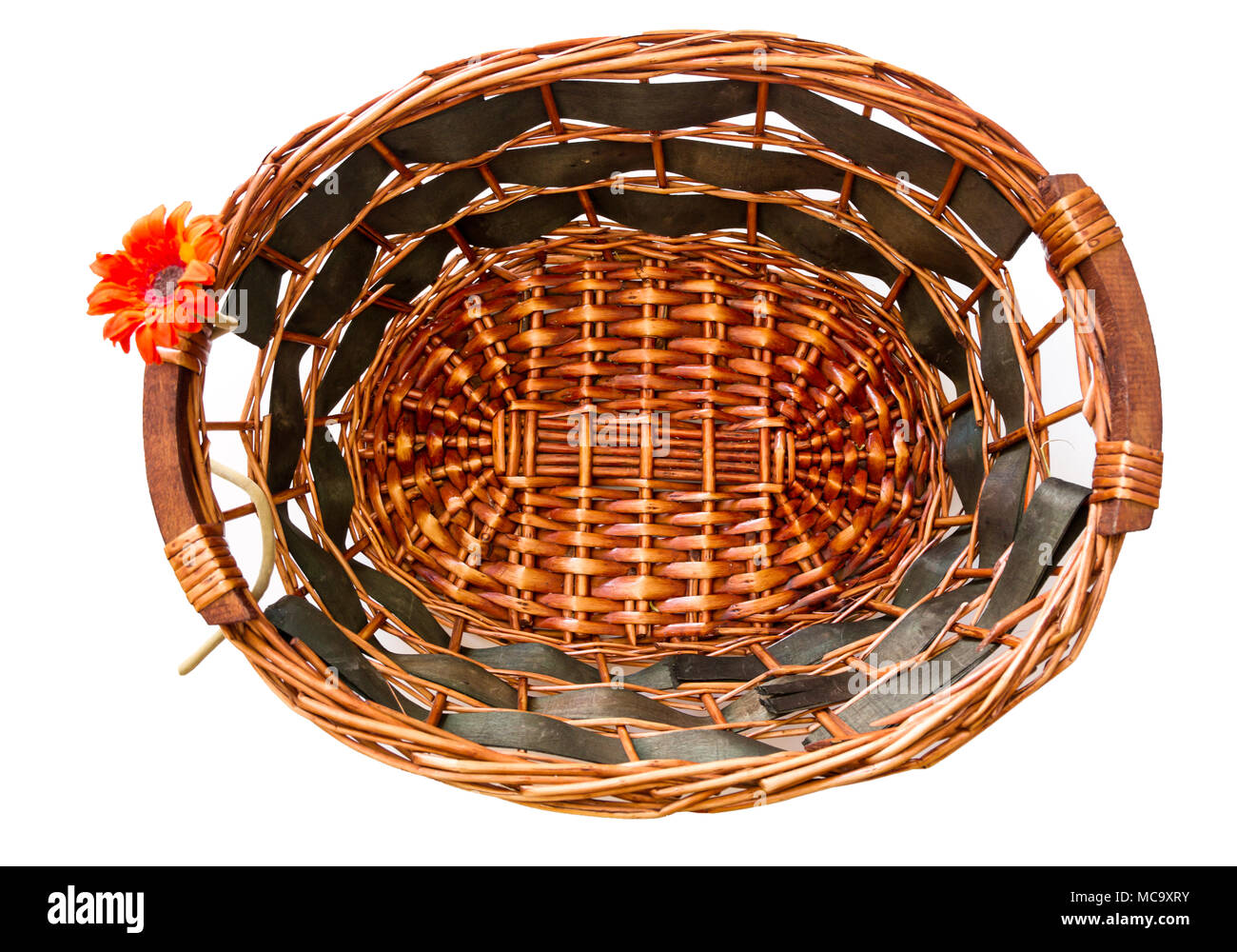 Empty handmade wooden basket on white background. Stock Photo
