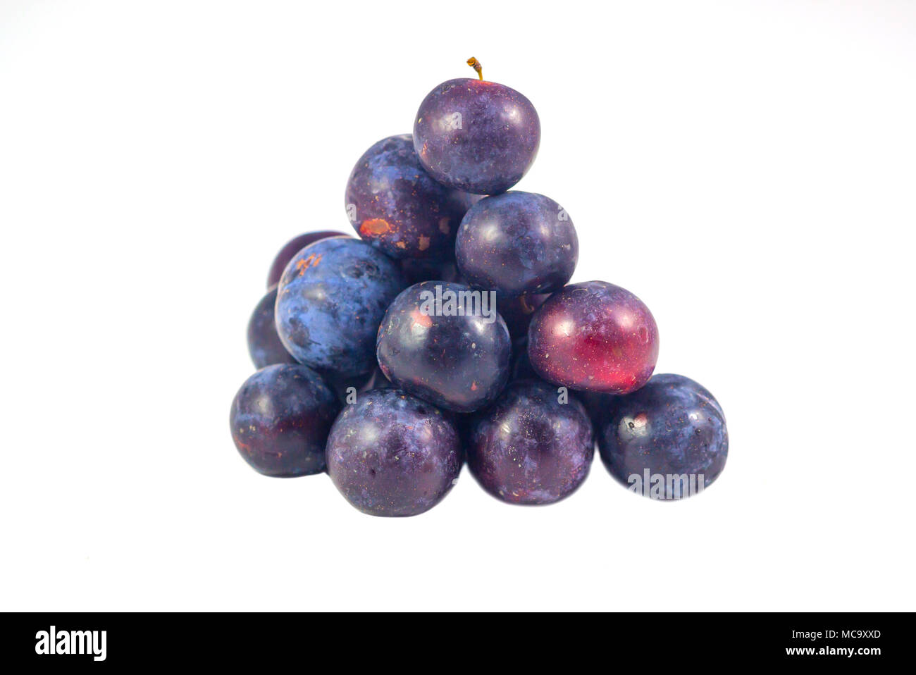 Sweet plum, prunes isolated on white background, Group of plums, prunes with leaf isolated on a white background. Fresh of plum, prunes fruit that hel Stock Photo