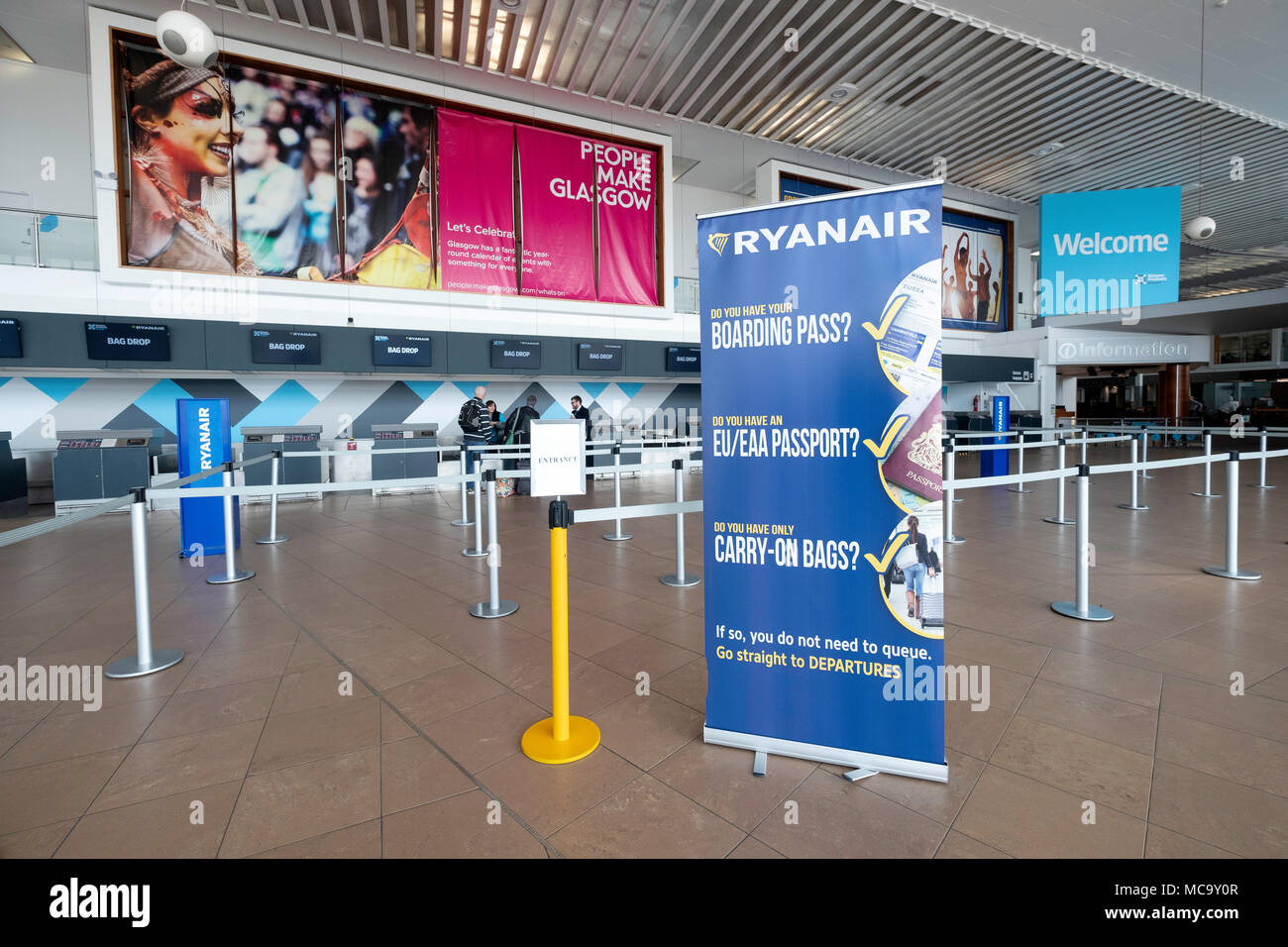 Very quiet check in desks operated by Ryanair at Prestwick Airport in Ayrshire, Scotland, UK Stock Photo