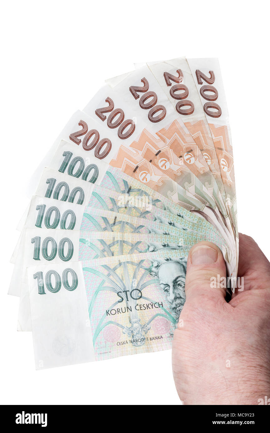 Czech money. Man holding and fanning out 100 and 200 korun banknotes. Stock Photo