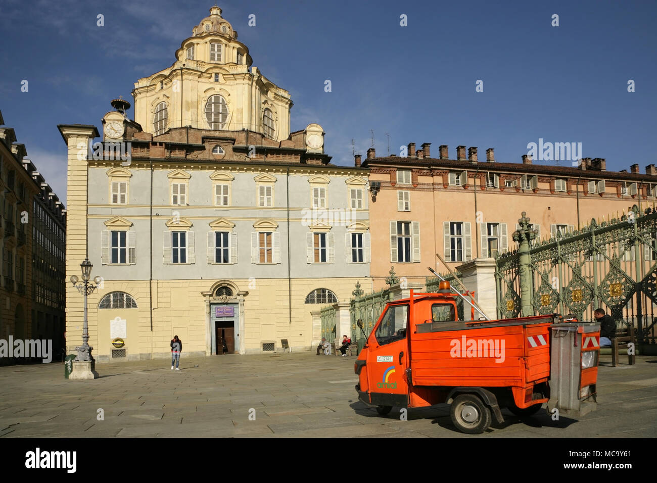 Rubbish collector's Piaggio Ape 50 in front of the dome and tower of the 17th century Royal Church of San Lorenzo, Piazza Castello, Turin, Stock Photo