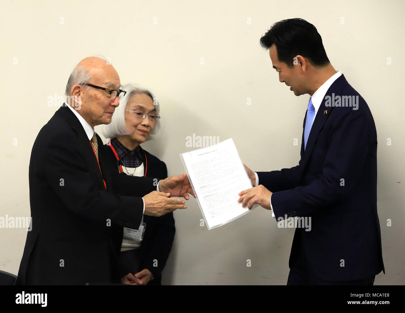 Tokyo, Japan. 13th Apr, 2018. Japanese vice Foreign Minister Mitsunari Okamoto (R) receives a written demand for this month's meeting of the 2020 review conference of the Nuclear Nonproliferation Treaty (NPT) from A-bomb survivors Terumi Tanaka (L) and Haruko Moritaki (C) at the foreign ministry in Tokyo on Friday, April 13, 2018. Credit: Yoshio Tsunoda/AFLO/Alamy Live News Stock Photo