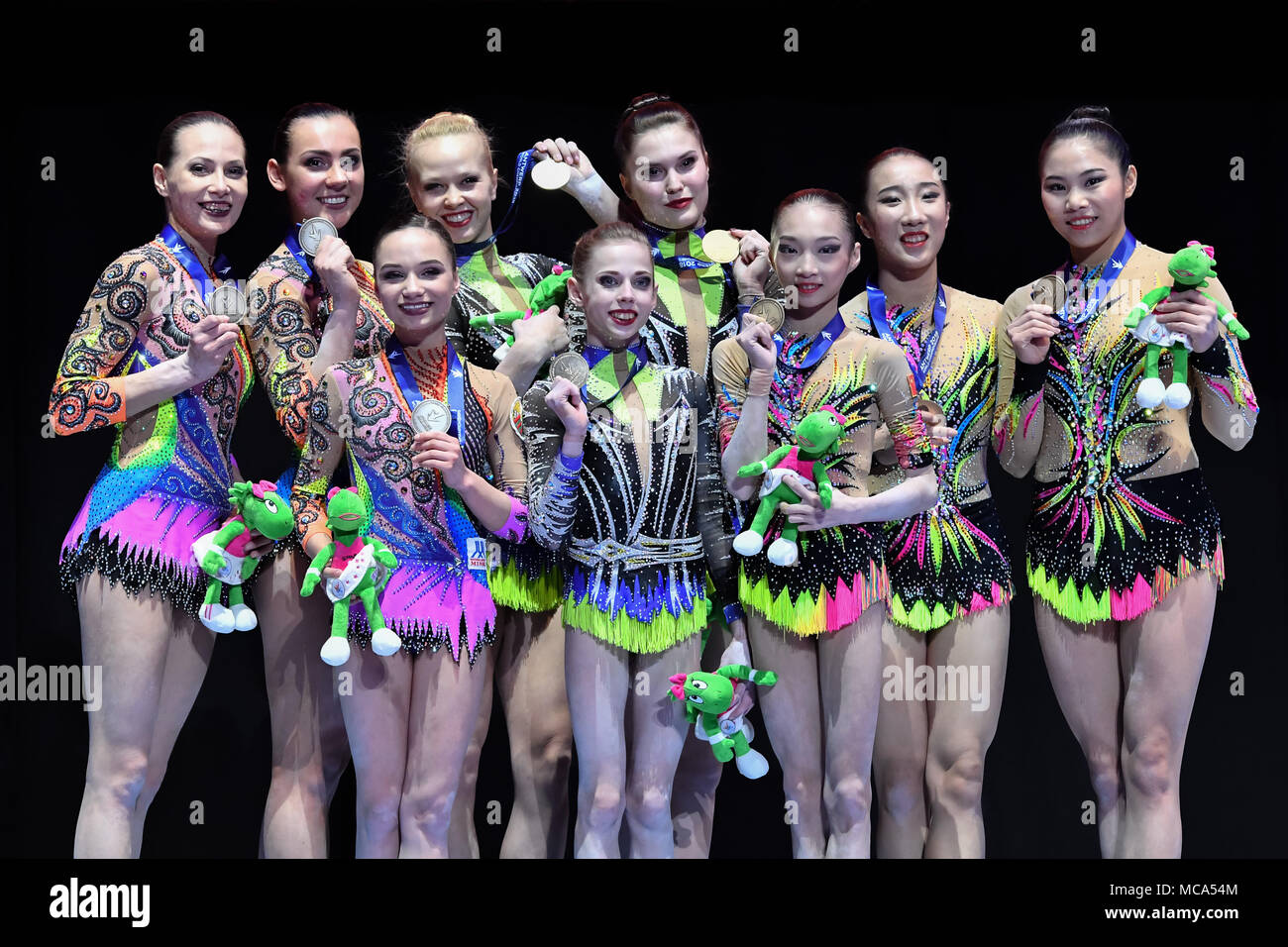 Antwerp, Belgium, 14 April 2018. Duan Yushan, Ji Qiuqiong and Liu Jieyu (R, CHN) and Daria Chebulanka, Polina Plastinina and Kseniia Zagoskina (C, RUS) and Julia Ivohnchyk, Veranika Nabokina and Karina Sandvoch (L, BLR) at Winners Presentation after Men's group Final during the 26th World Championships Acrobatics Gymnastics 2018 at Lotto Arena on Saturday, 14 April 2018. A Credit: Taka Wu/Alamy Live News Stock Photo