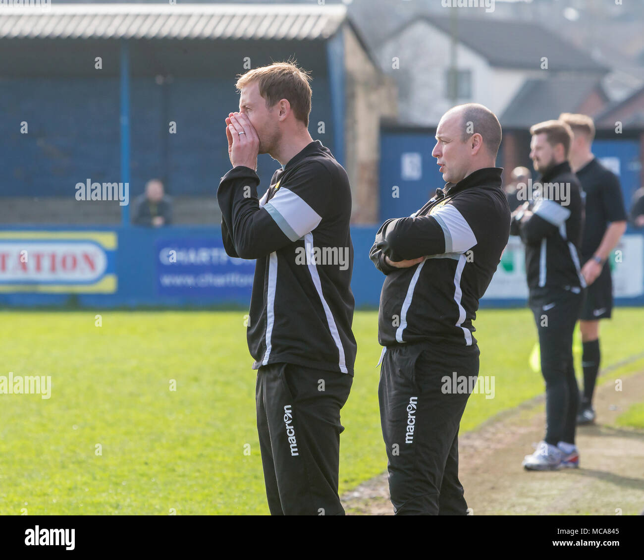 Warrington Town assistant manager, Mark Beesley, and manager, Paul Carden, watch the match at Throstle Nest, Farsley during the game between Warrington Town FC and Farsley Celtic on 14 April 2018 where Warrington won 2 - 0 Credit: John Hopkins/Alamy Live News Stock Photo