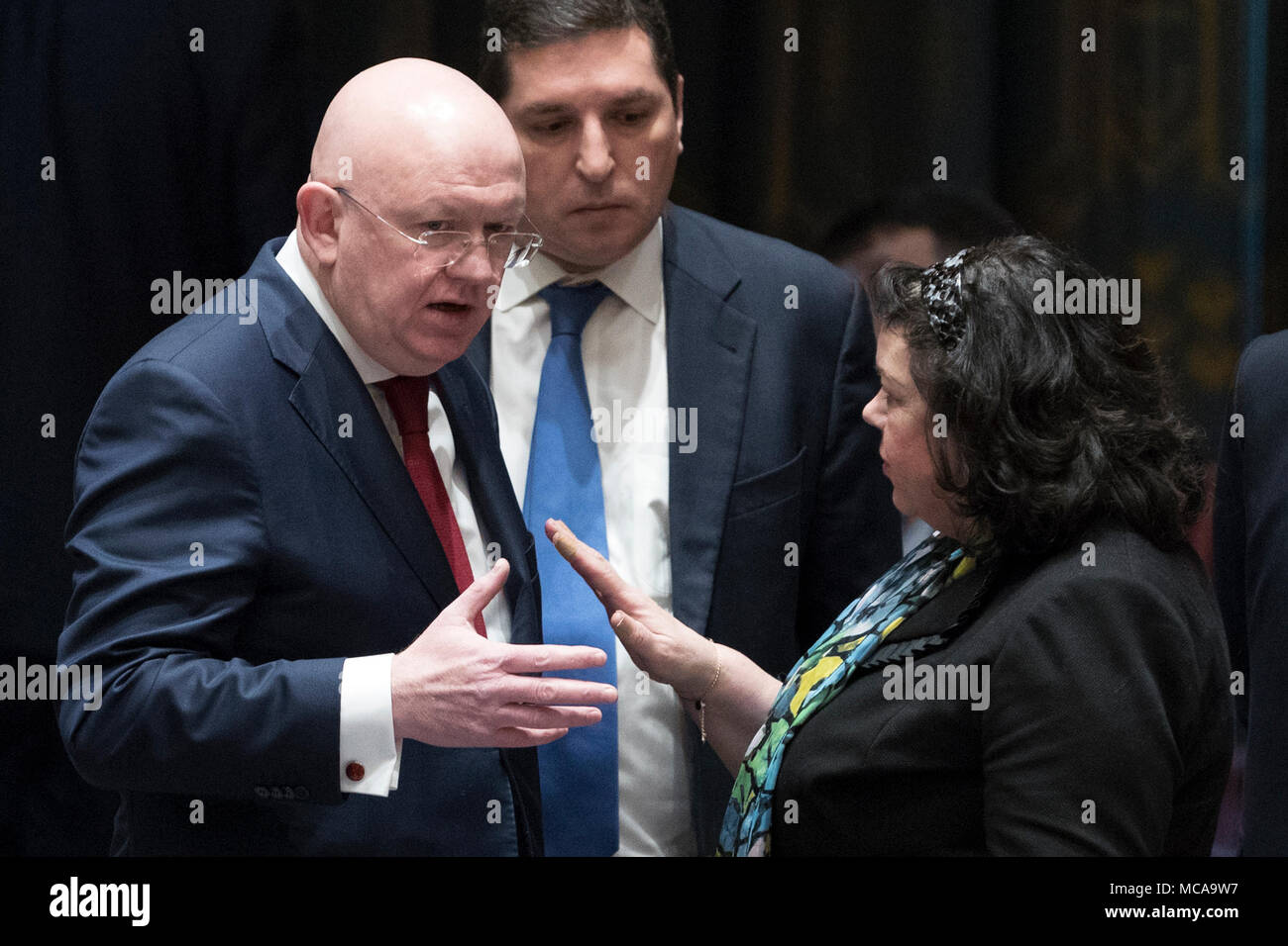 Untied Nations. 14th Apr, 2018. British Ambassador to the United Nations Karen Pierce (R front) talks to Russian Ambassador to UN Vassily Nebenzia(L front) before a Security Council emergency meeting on Syria at the UN headquarters in New York, April 14, 2018. A Russian-drafted resolution, which would have condemned the military strikes on Syria carried out by the United States, France and Britain, failed to be adopted by the Security Council. Credit: Li Muzi/Xinhua/Alamy Live News Stock Photo