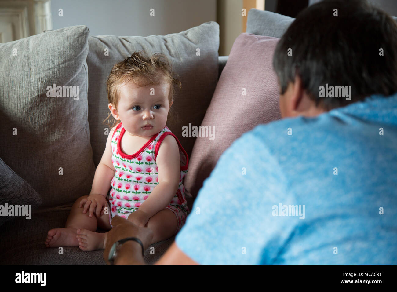 Family meeting their 10 month old niece Stock Photo