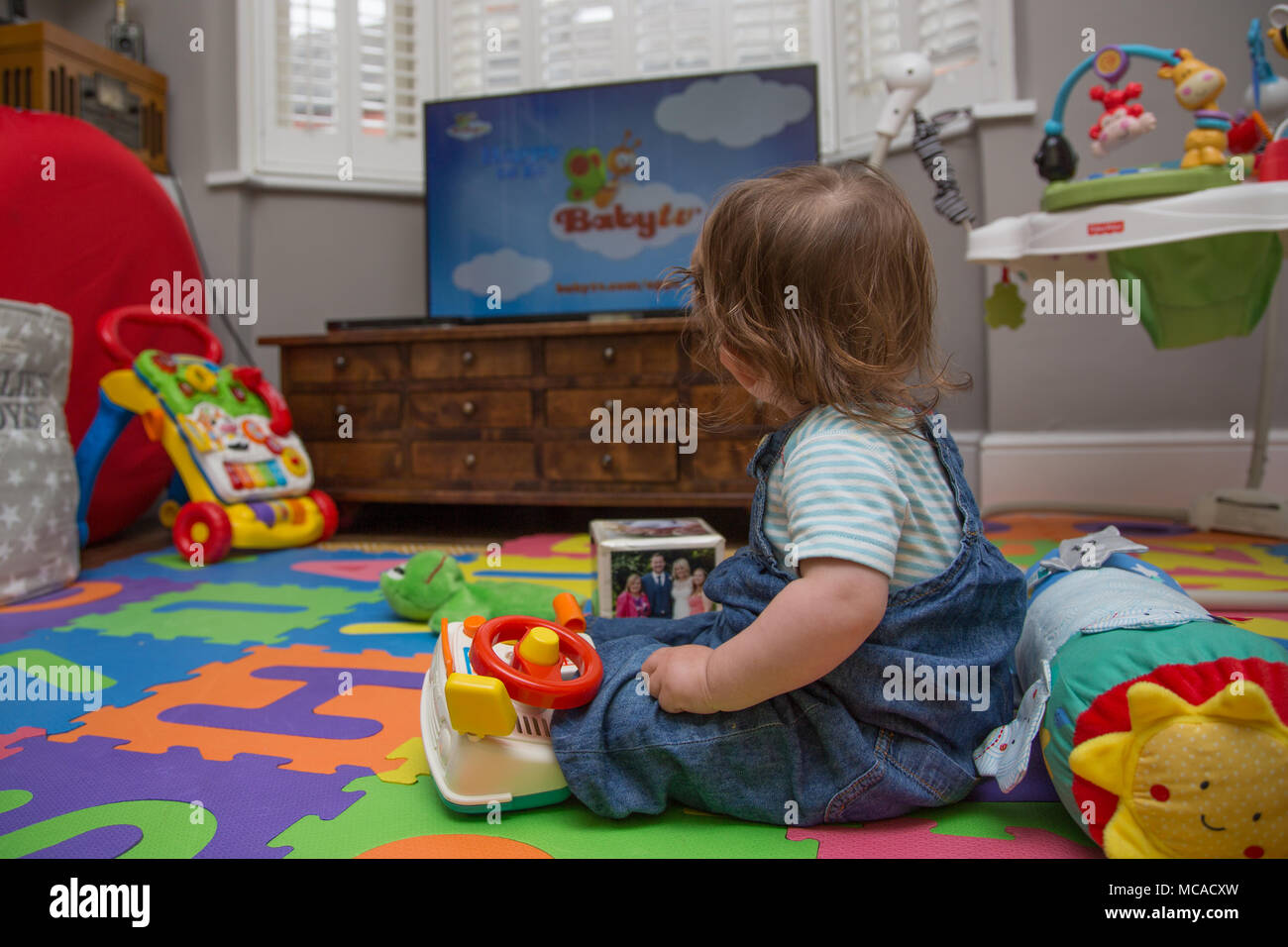 Toddler watching cartoons hi res stock photography and images Alamy