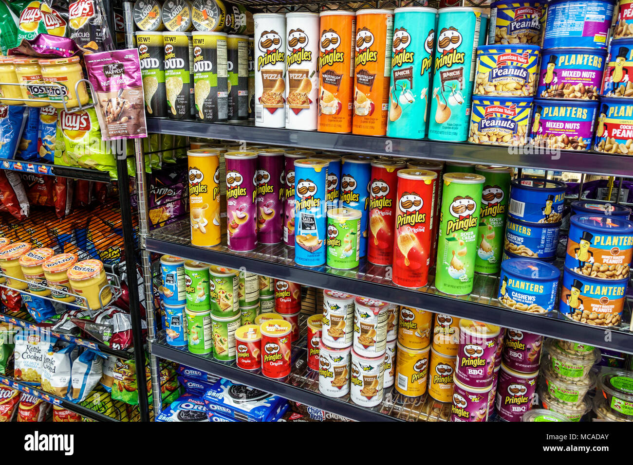 Miami Beach Florida,South Beach,La Playa,market,grocery store,display,Pringles,potato chips,Planters,peanuts,snacks,wire shelf,FL180302003 Stock Photo