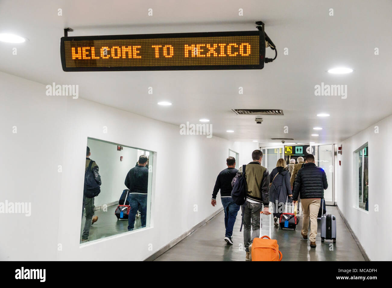 Mexico City,Mexican,Hispanic Latin Latino ethnic,Benito Juarez International Airport MEX,arrival,LED sign,welcome,English language,adult adul Stock Photo