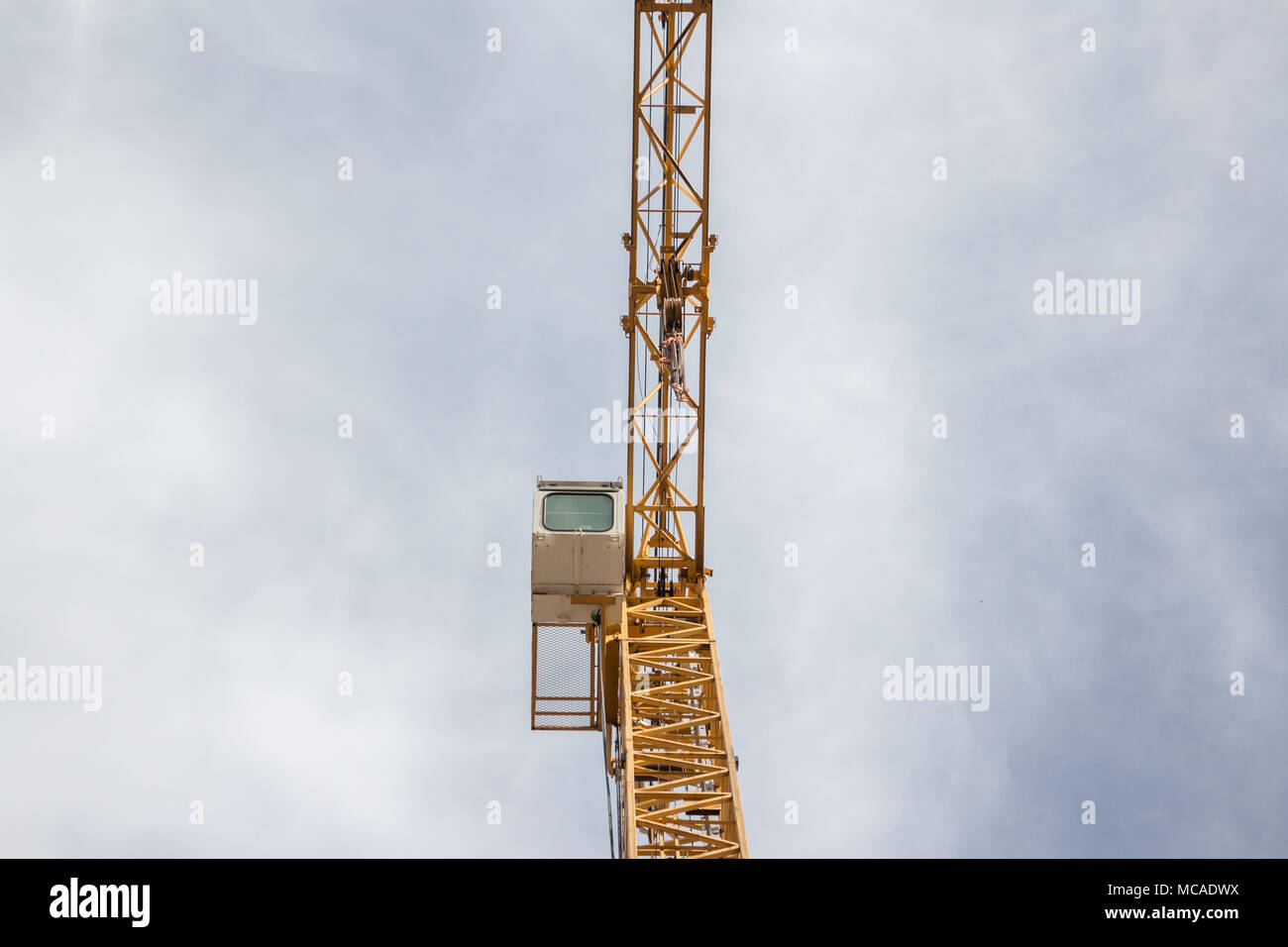 Construction crane against cloudy sky , looking up Stock Photo - Alamy