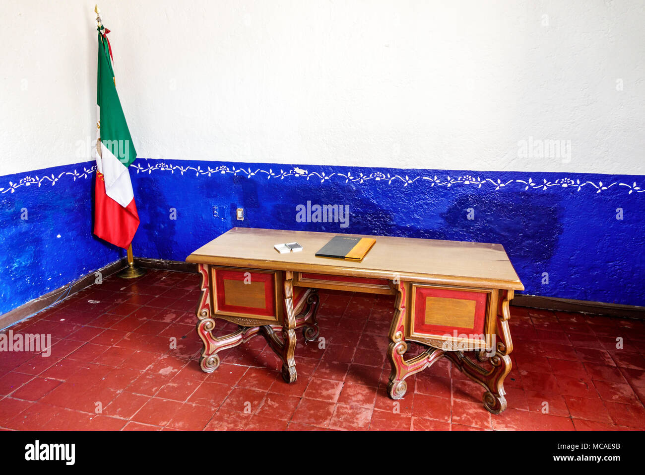 Mexico City,Mexican,Hispanic,Coyoacan,Del Carmen,Jardin Plaza Hidalgo,Hernan Cortes house,Town Hall,inside,office,vintage desk,flag MX180303061 Stock Photo