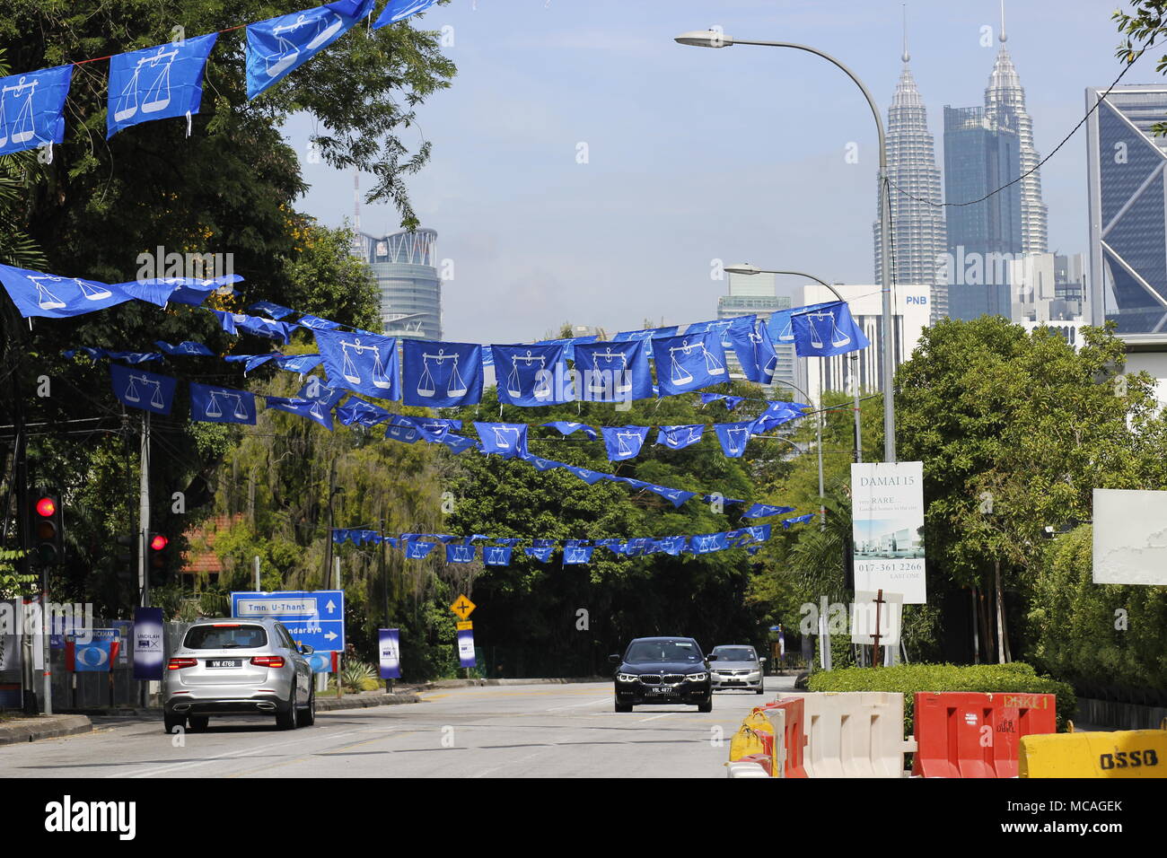 Malaysian General Elections 2018 campaigning in Kuala Lumpur, Malaysia. National coalition party flags in blue. Stock Photo