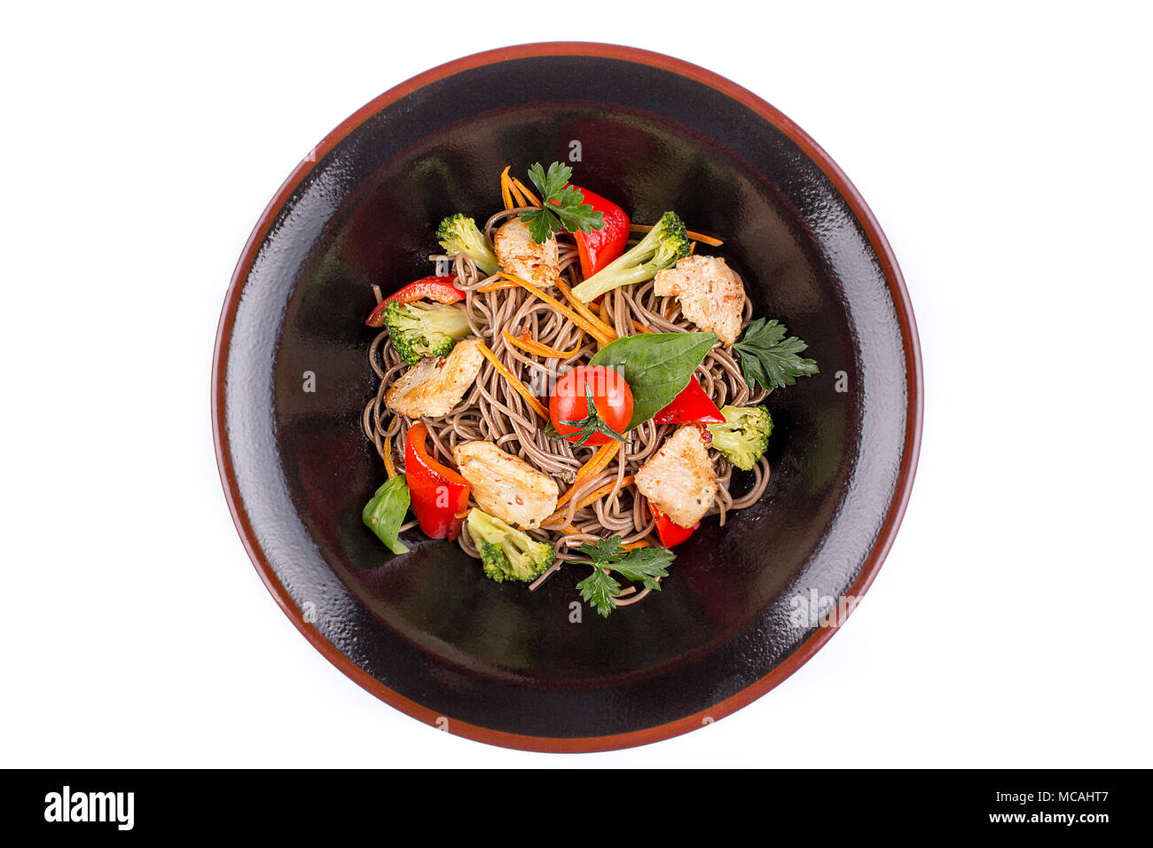 Buckwheat noodles with chicken and vegetables under teriyaki sauce