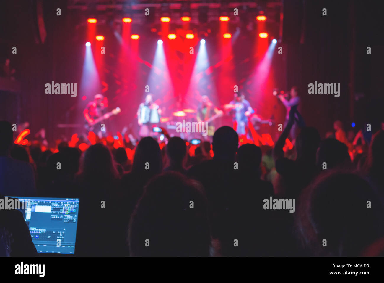 The audience watching the concert on stage Stock Photo - Alamy