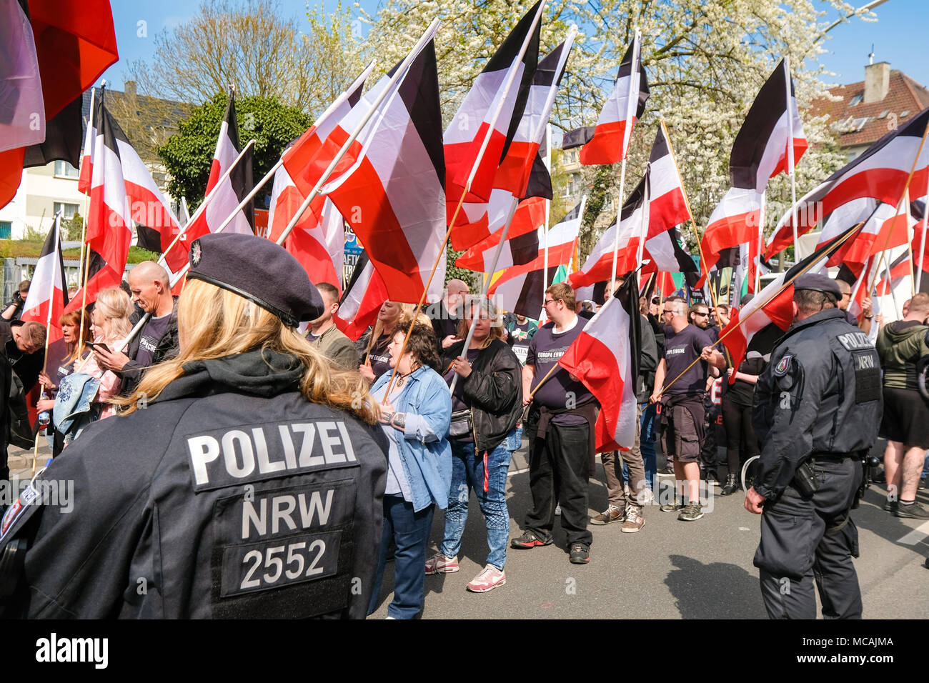 Dortmund, April 14th 2018: Neo-Nazi march in Dortmund/Germany. Right-wing extremist parties such as the party 'Die Rechte' (The Rights) demanding under the heading EUROPE AWAKE a 'white Europe' --- Dortmund 14.04.2018: Neonazi-Demonstration in Dortmund. Rechtsextremistische Parteien wie die Dortmunder Partei 'Die Rechte' fordern unter der Überschrift „EUROPA ERWACHE“ ein 'weisses Europa“ Stock Photo