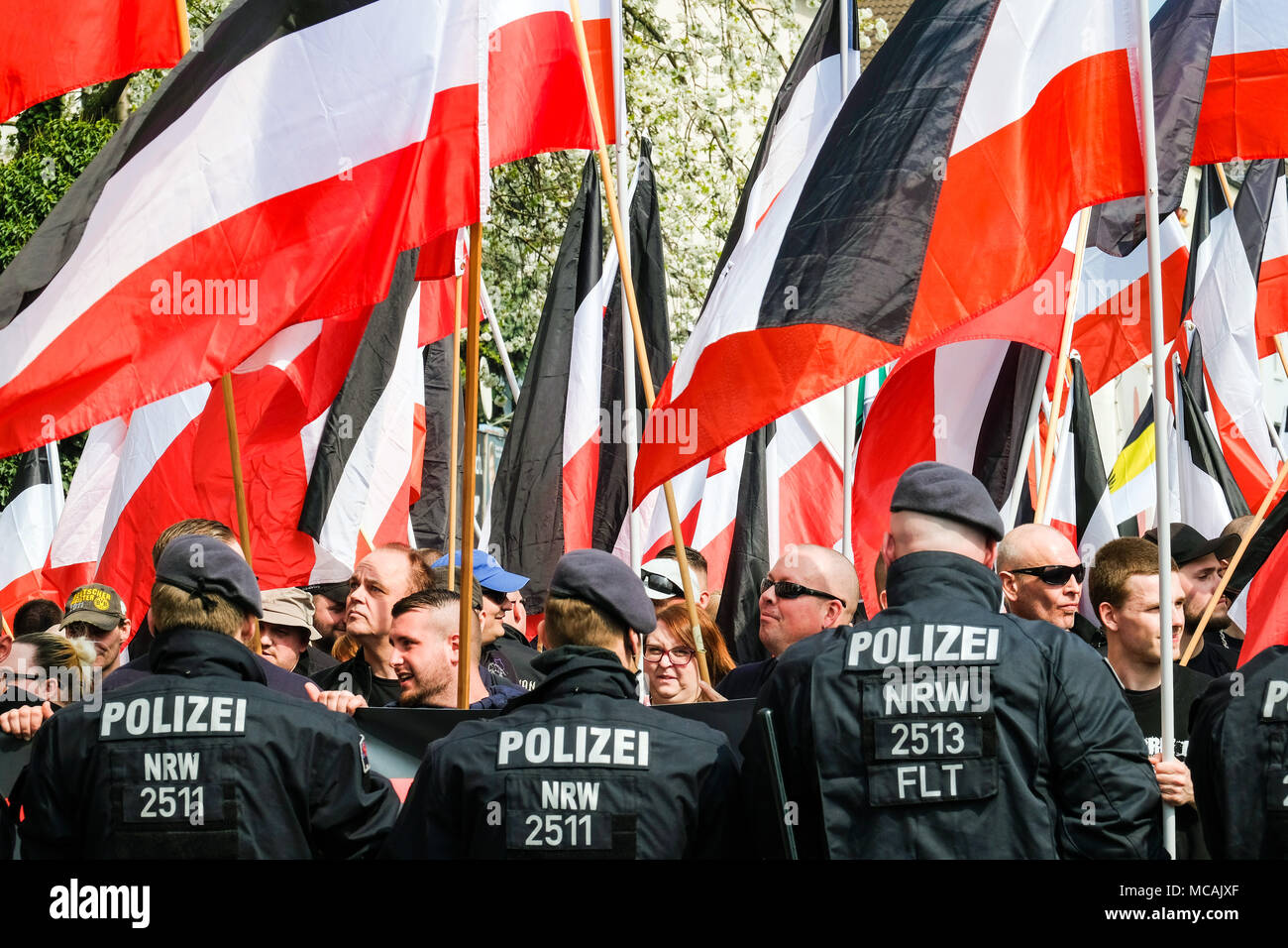 Dortmund, April 14th 2018: Neo-Nazi march in Dortmund/Germany. Right-wing extremist parties such as the party 'Die Rechte' (The Rights) demanding under the heading EUROPE AWAKE a 'white Europe' --- Dortmund 14.04.2018: Neonazi-Demonstration in Dortmund. Rechtsextremistische Parteien wie die Dortmunder Partei 'Die Rechte' fordern unter der Überschrift „EUROPA ERWACHE“ ein 'weisses Europa“ Stock Photo