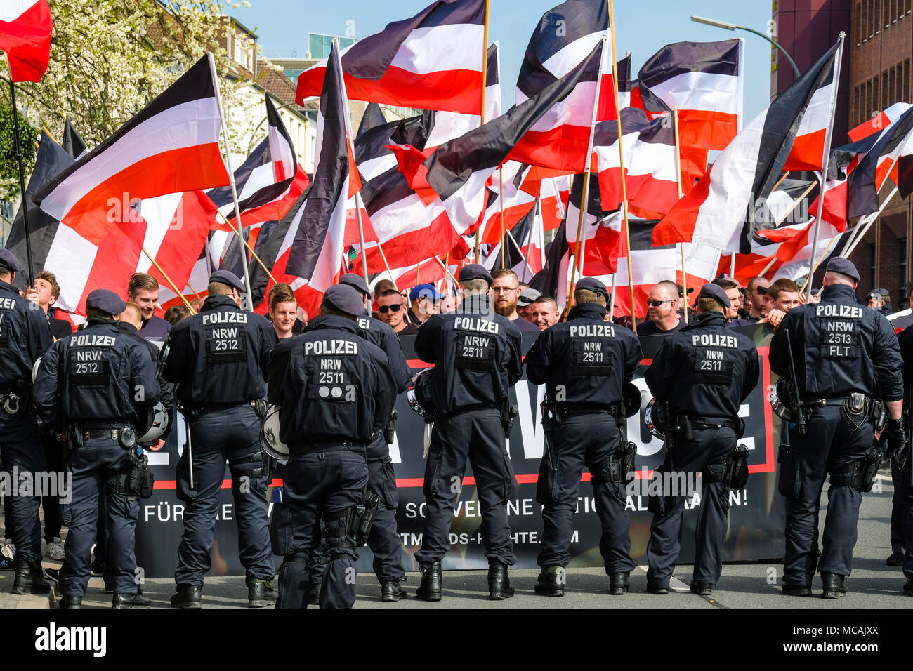 Dortmund, April 14th 2018: Neo-Nazi march in Dortmund/Germany. Right-wing extremist parties such as the party 'Die Rechte' (The Rights) demanding under the heading EUROPE AWAKE a 'white Europe' --- Dortmund 14.04.2018: Neonazi-Demonstration in Dortmund. Rechtsextremistische Parteien wie die Dortmunder Partei 'Die Rechte' fordern unter der Überschrift „EUROPA ERWACHE“ ein 'weisses Europa“ Stock Photo