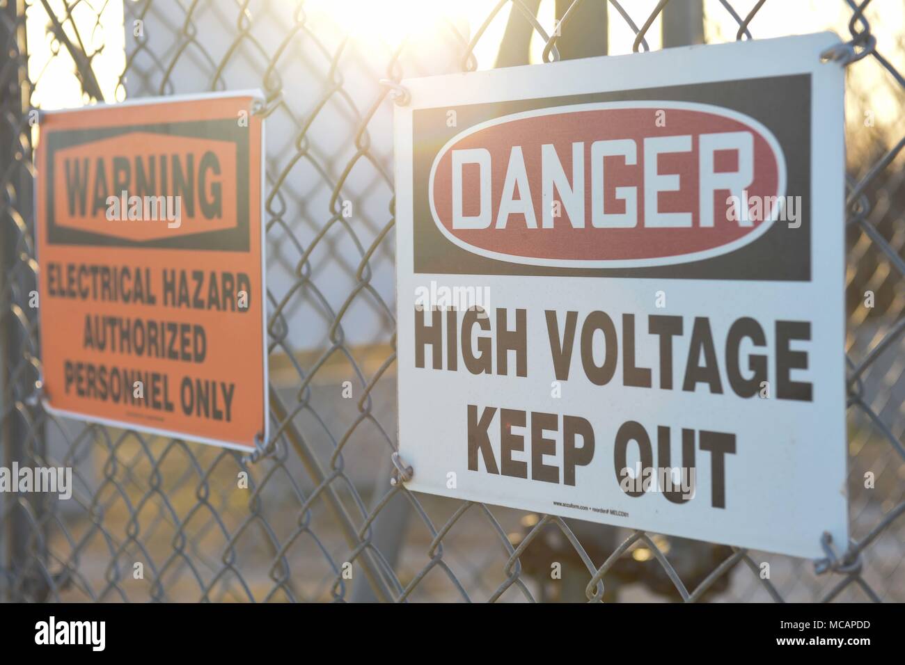 Danger and warning signs are displayed on the fence of an electrical breaker unit to warn people