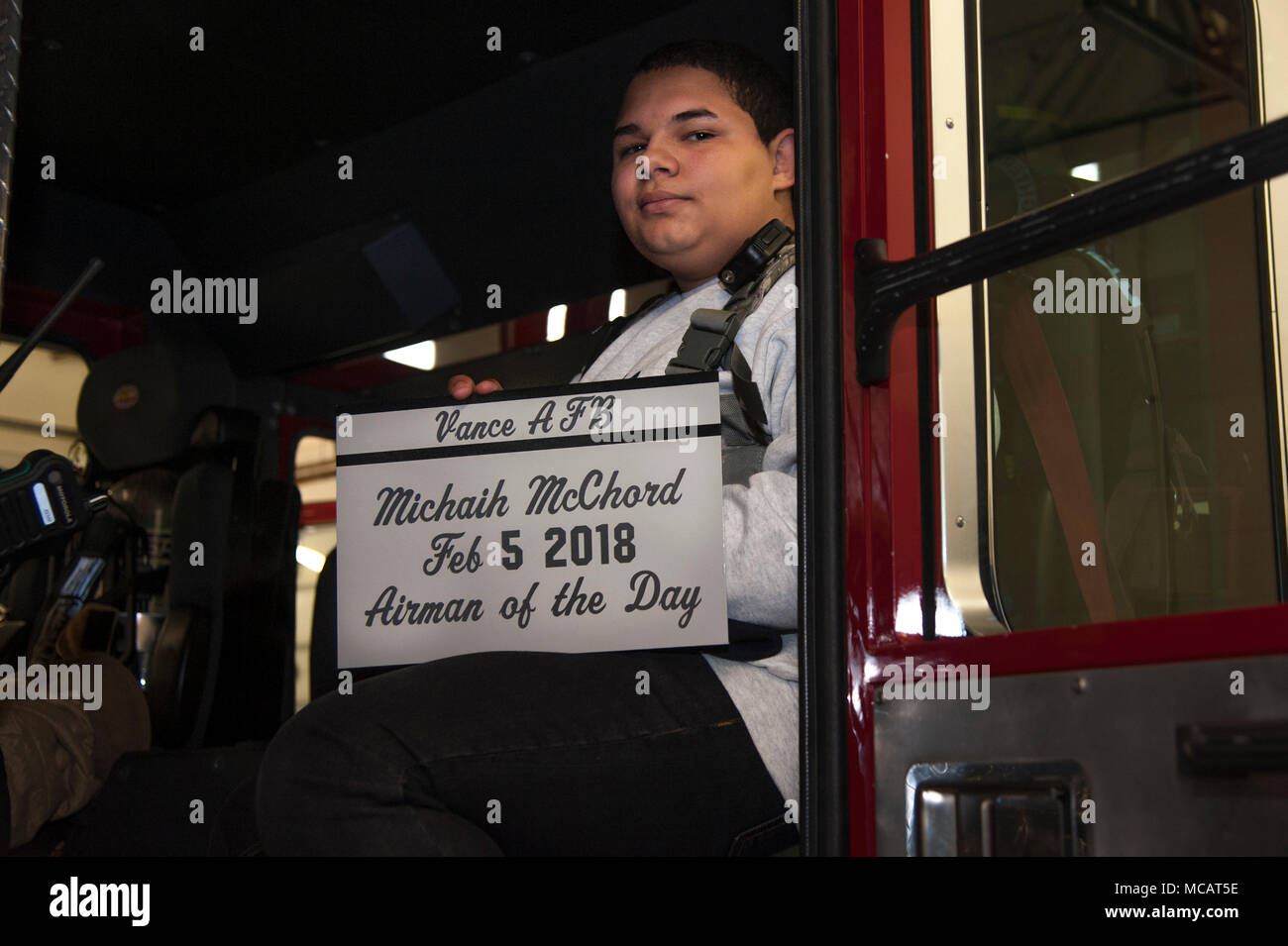 Michaih McChord, a sophomore at Enid High School, Enid, Okla., poses for a photo inside a Vance fire engine Feb. 5, 2018, at Vance Air Force Base, Okla. McChord was selected to be the Airman for a Day because of his leadership in his high school’s Air Force Junior Reserve Officers' Training Corps program. (U.S. Air Force photo by Airman Zachary Heal) Stock Photo