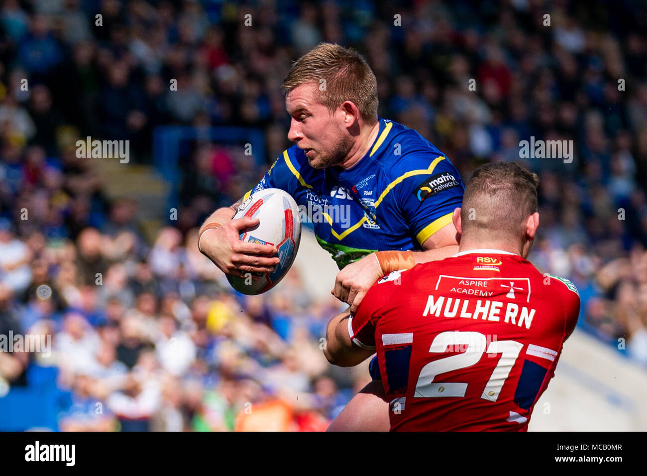 Warrington Wolves's Mike Cooper is tackled by Hull's Robbie Mulhern  14th April 2018 , The Halliwell Jones Stadium Mike Gregory Way, Warrington, WA2 7NE, England;  Betfred Super League rugby, Round 11, Warrington Wolves v Hull Kingston Rovers Stock Photo