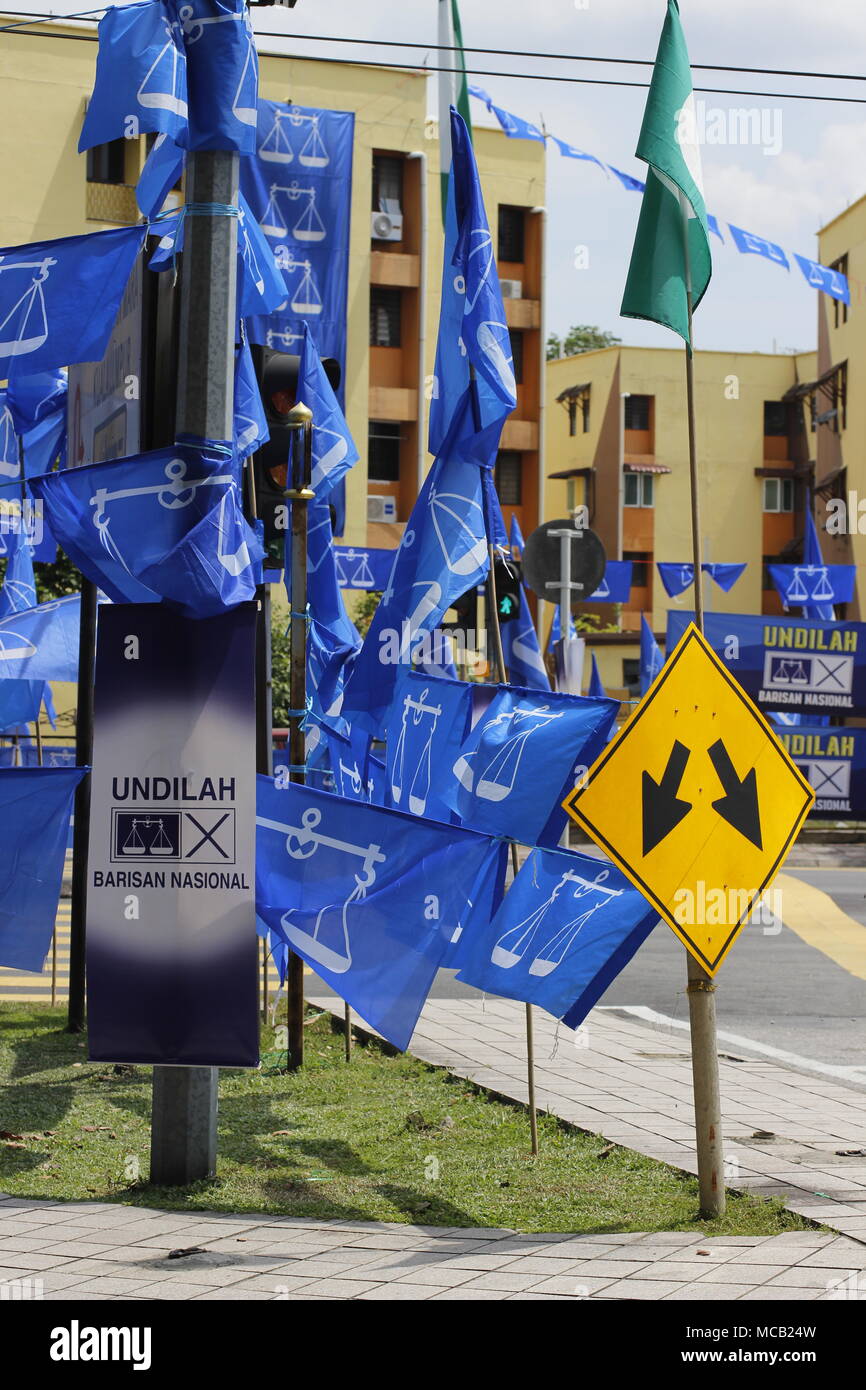 Kuala Lumpur, Malaysia. 15th April, 2018. The upcoming May 2018 general elections is expected to be a keenly contested fight between the ruling coalition party and the opposition alliance. Which way will it go? Blue flags seen here belong to the ruling party Barisan Nasional. Credit: Beaconstox/Alamy Live News. Stock Photo