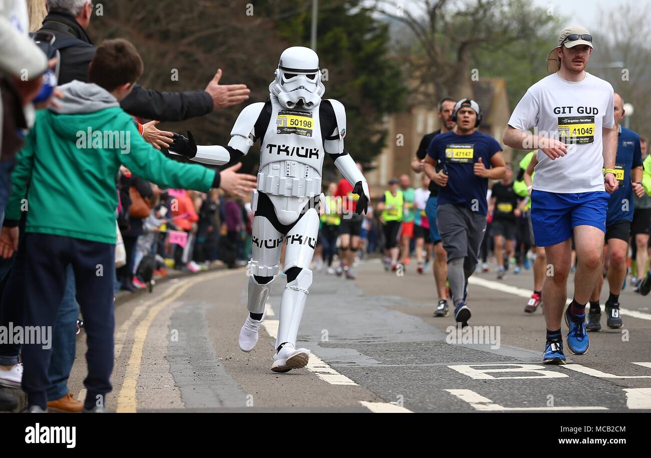 Brighton, Sussex UK 15th April 2018 -  A Star Wars Storm Trooper  takes part in the Brighton Marathon in Southern England. Credit: James Boardman/Alamy Live News Stock Photo