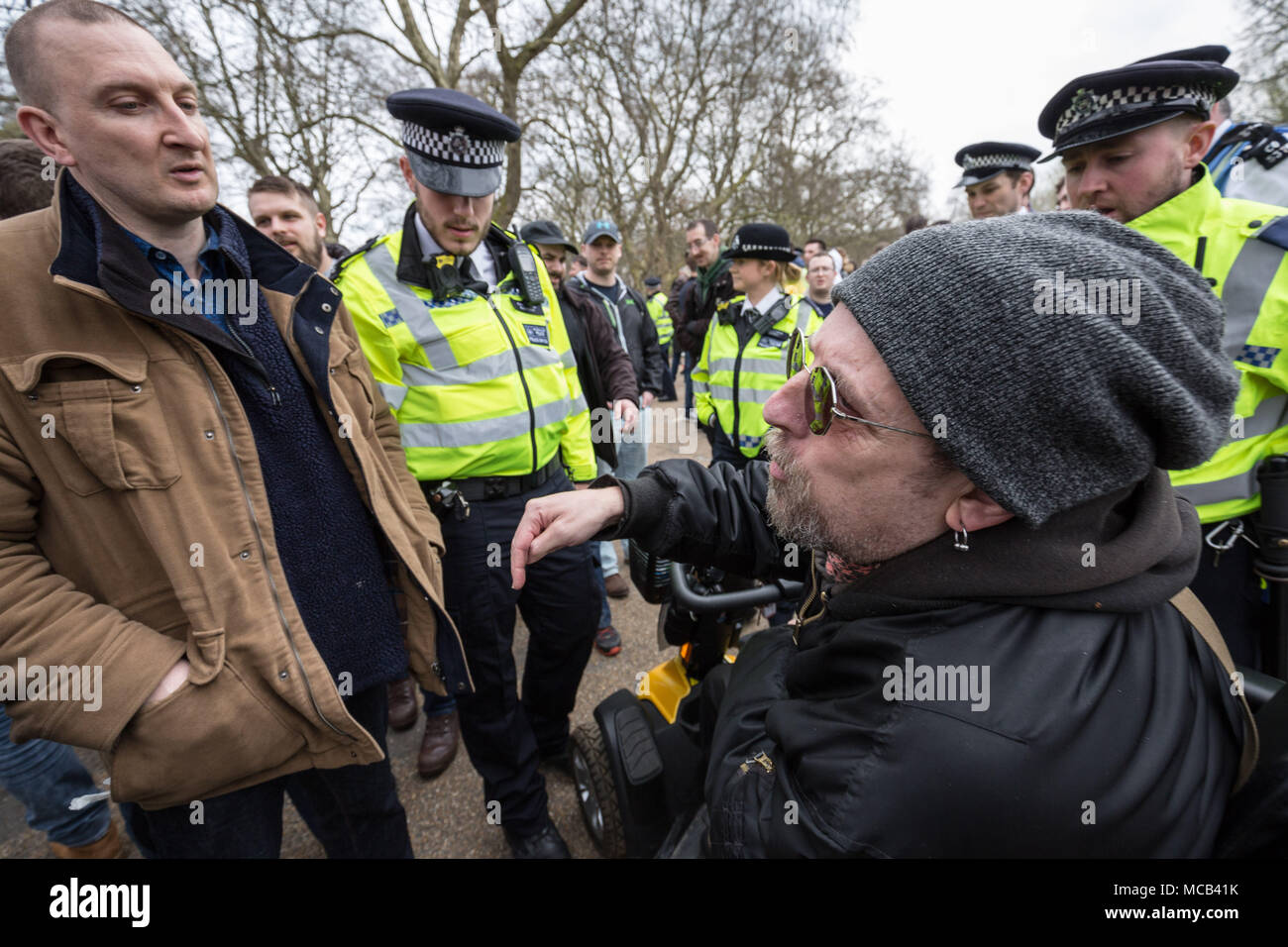 London, UK. 15th April, 2018. Confrontations between nationalist members (L) and opposing anti-fascist activists (R) in Hyde Park as members of the right-wing Generation Identity movement wait to hear a speech by a representative from the German women’s 120dB movement. Credit: Guy Corbishley/Alamy Live News Stock Photo