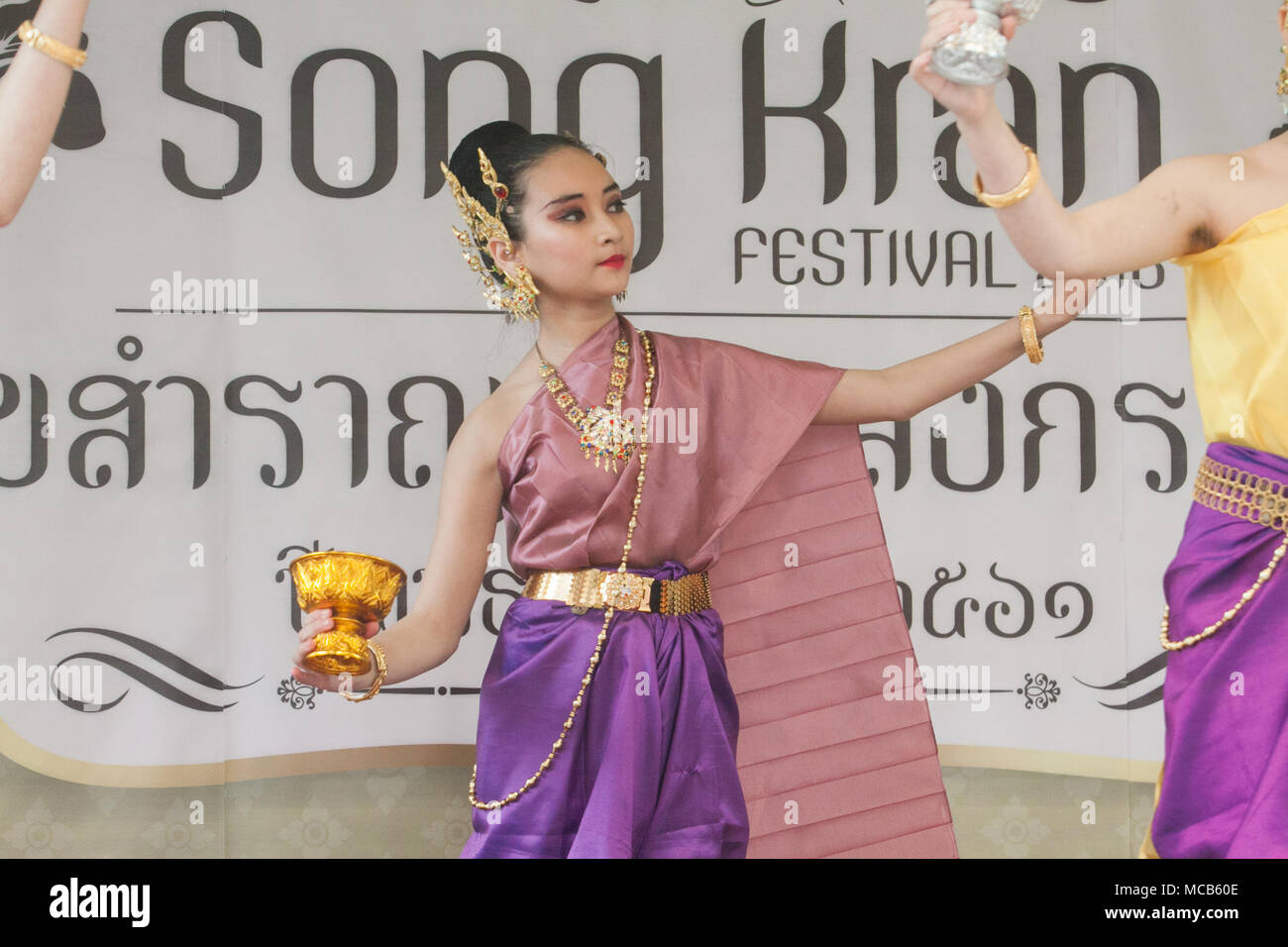 London UK. 15th April 2018.  Traditonal Thai dancers performs  at the Thai New Year (Songkran) at the Buddhapadipa Temple in Wimbledon, the largest Thai temple in the UK with religious ceremonies Thai classical music and dancing performances as well as stalls selling Thai food, groceries and souvenirs Stock Photo