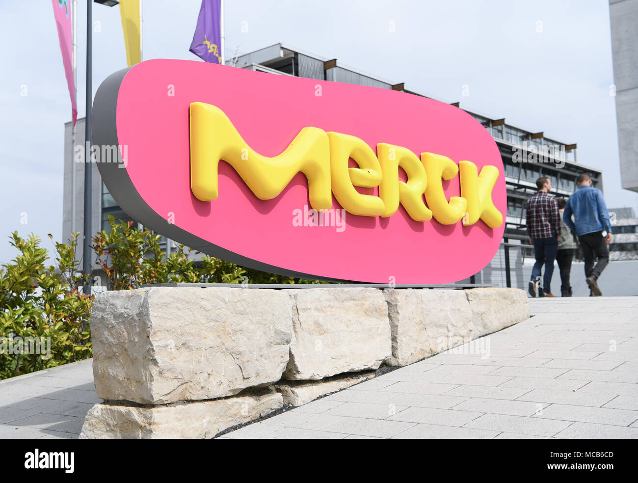 09 April 2018, Germany, Darmstadt: The lettering of the pharmaceutical and chemical group Merck KGaA in front of a buildong at the main factory. The company, which was founded in 1668, celebrates its 350th anniversary this year. Photo: Arne Dedert/dpa Stock Photo