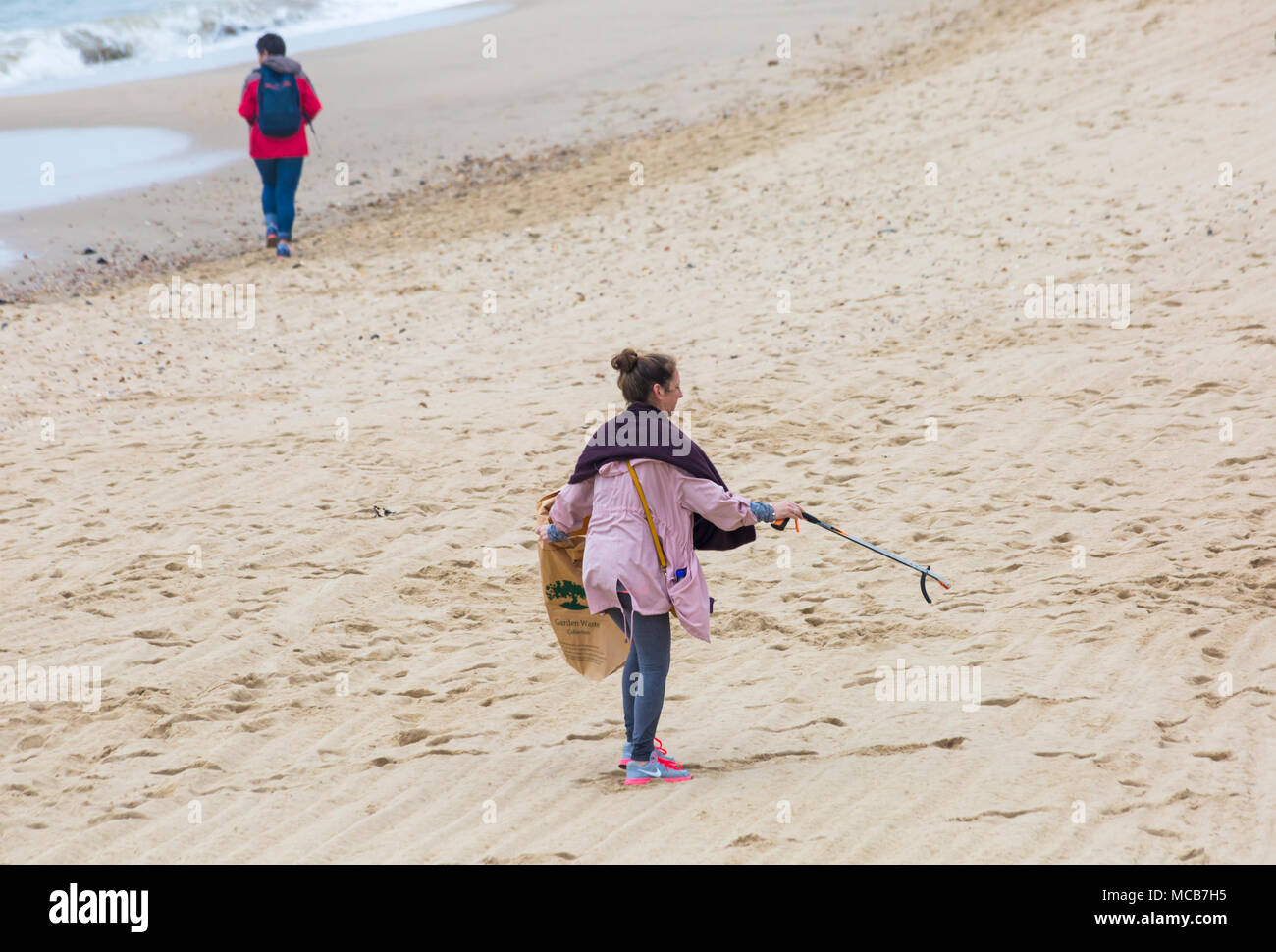 Bournemouth, Dorset, UK. 15th April 2018. Plastic Free Bournemouth hold their first community beach clean as part of Surfers against Sewage Spring Beach Clean. Volunteers take part in picking up litter between Boscombe Pier and Bournemouth Pier, despite the dreary weather with rain on its way. Credit: Carolyn Jenkins/Alamy Live News Stock Photo