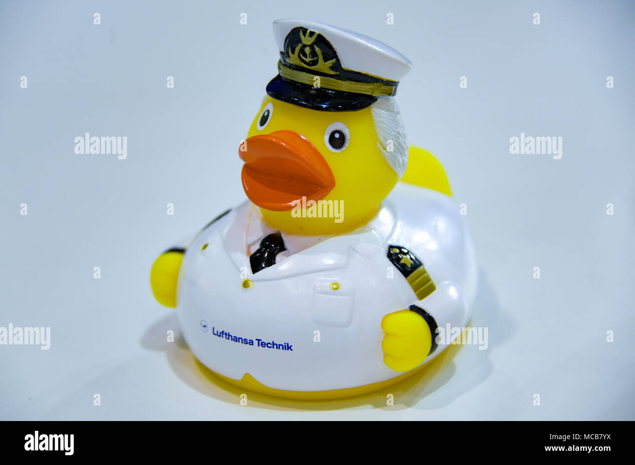 10 April 2018, Germany, Hamburg: A rubber duck featuring the uniform of an  aircraft captain is on display at the fair stand of Lufthansa Technik at  the Aircraft Interiors Expo. Photo: Axel