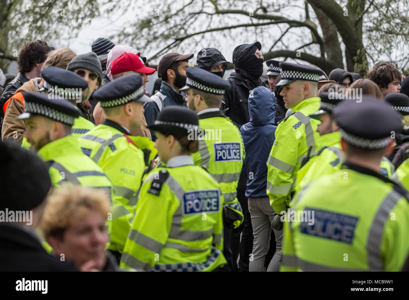 London, UK. 15th April, 2018. Anti-fascist counter-protesters. Nationalist members and supporters of the right-wing group Generation Identity gather in Hyde Park under heavy police supervision to hear a speech by a representative from the German women’s 120dB movement. Credit: Guy Corbishley/Alamy Live News Stock Photo