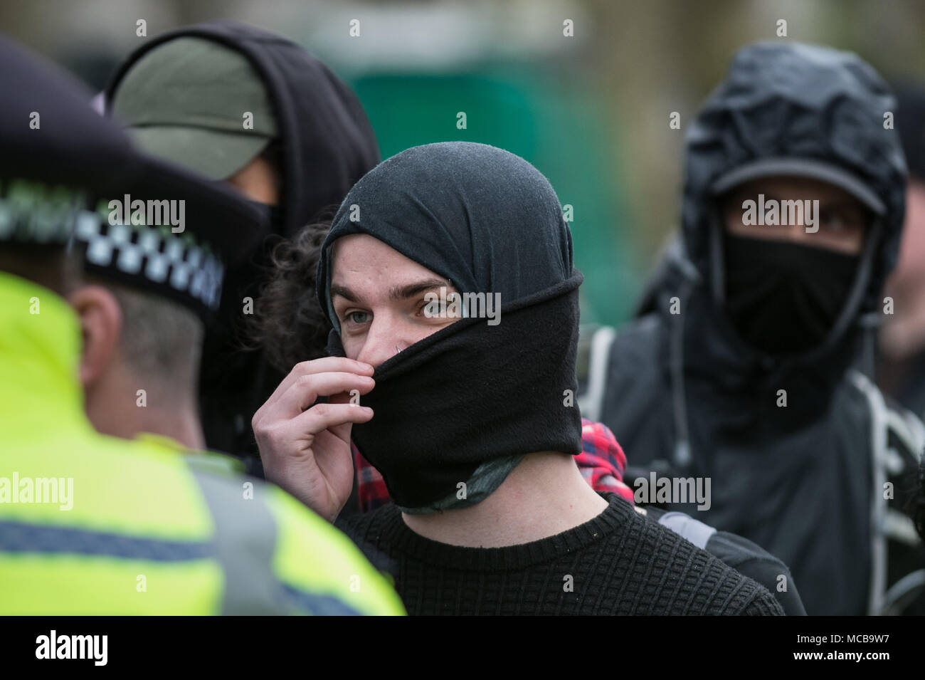 London, UK. 15th April, 2018. Anti-fascist counter-protesters. Nationalist members and supporters of the right-wing group Generation Identity gather in Hyde Park under heavy police supervision to hear a speech by a representative from the German women’s 120dB movement. Credit: Guy Corbishley/Alamy Live News Stock Photo