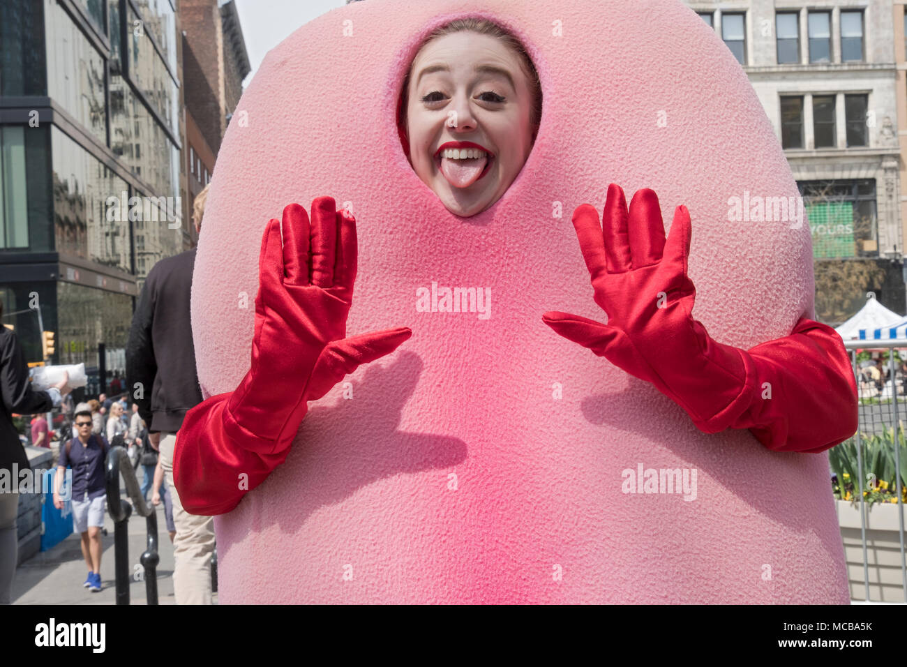 An actress & performance artist in Union Square Park advertising a product to use for cleaning one's tongue. In Manhattan, New York City. Stock Photo
