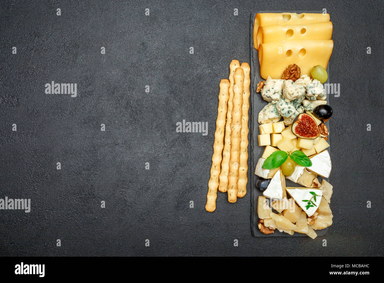 various types of cheese on stone board Stock Photo